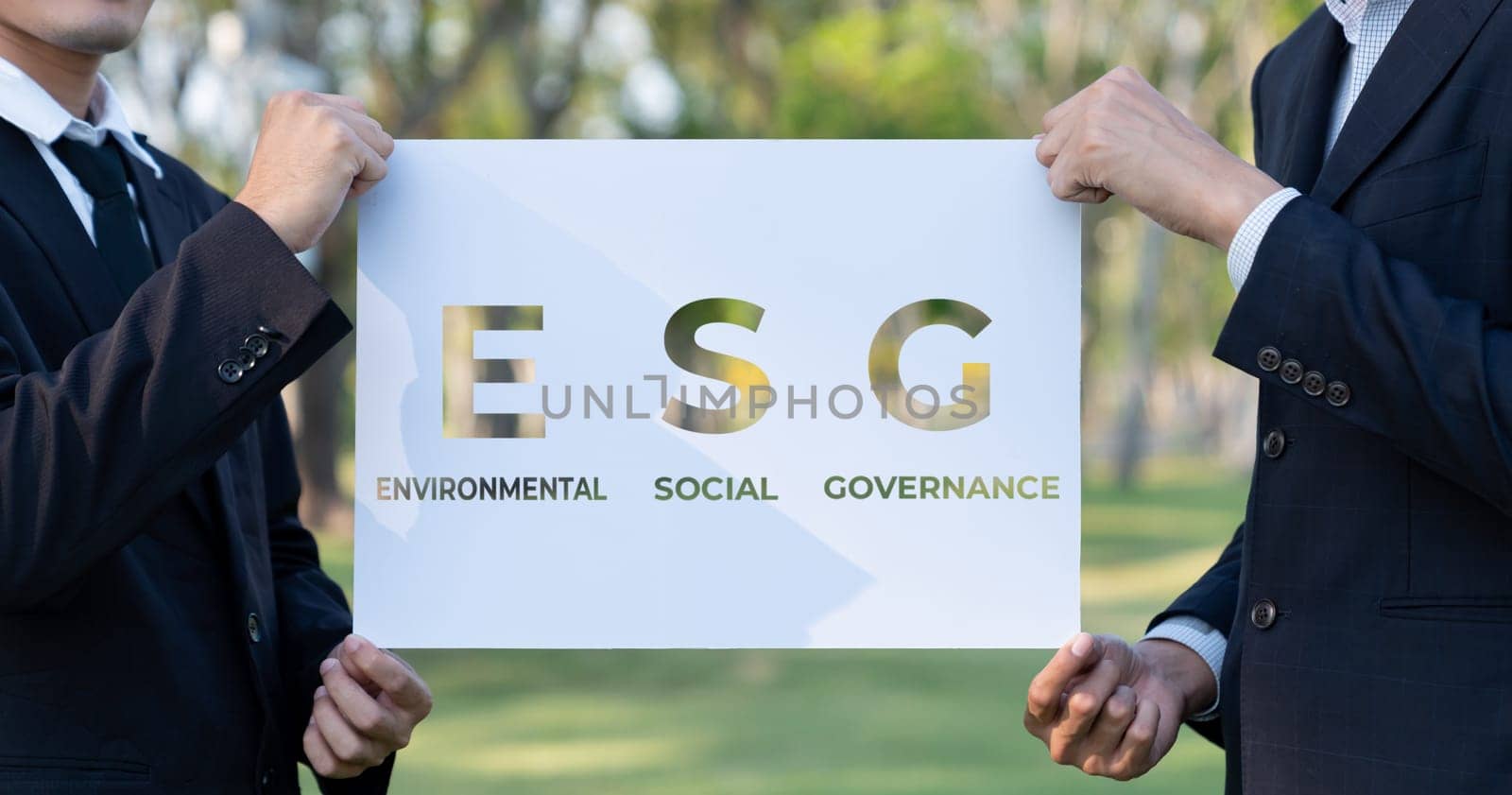 Group of business people stand united, holding eco-friendly idea and concept for environmental awareness campaign and embracing ESG principle for greener environment and sustainable future. Gyre