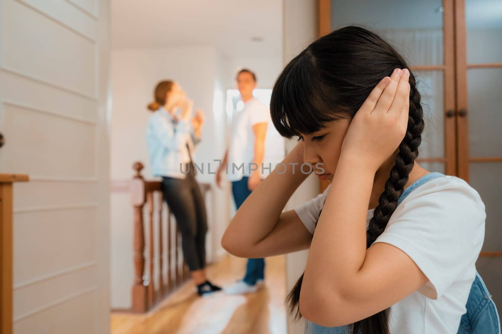 Stressed and unhappy young girl hide from domestic violence at home. Synchronos by biancoblue