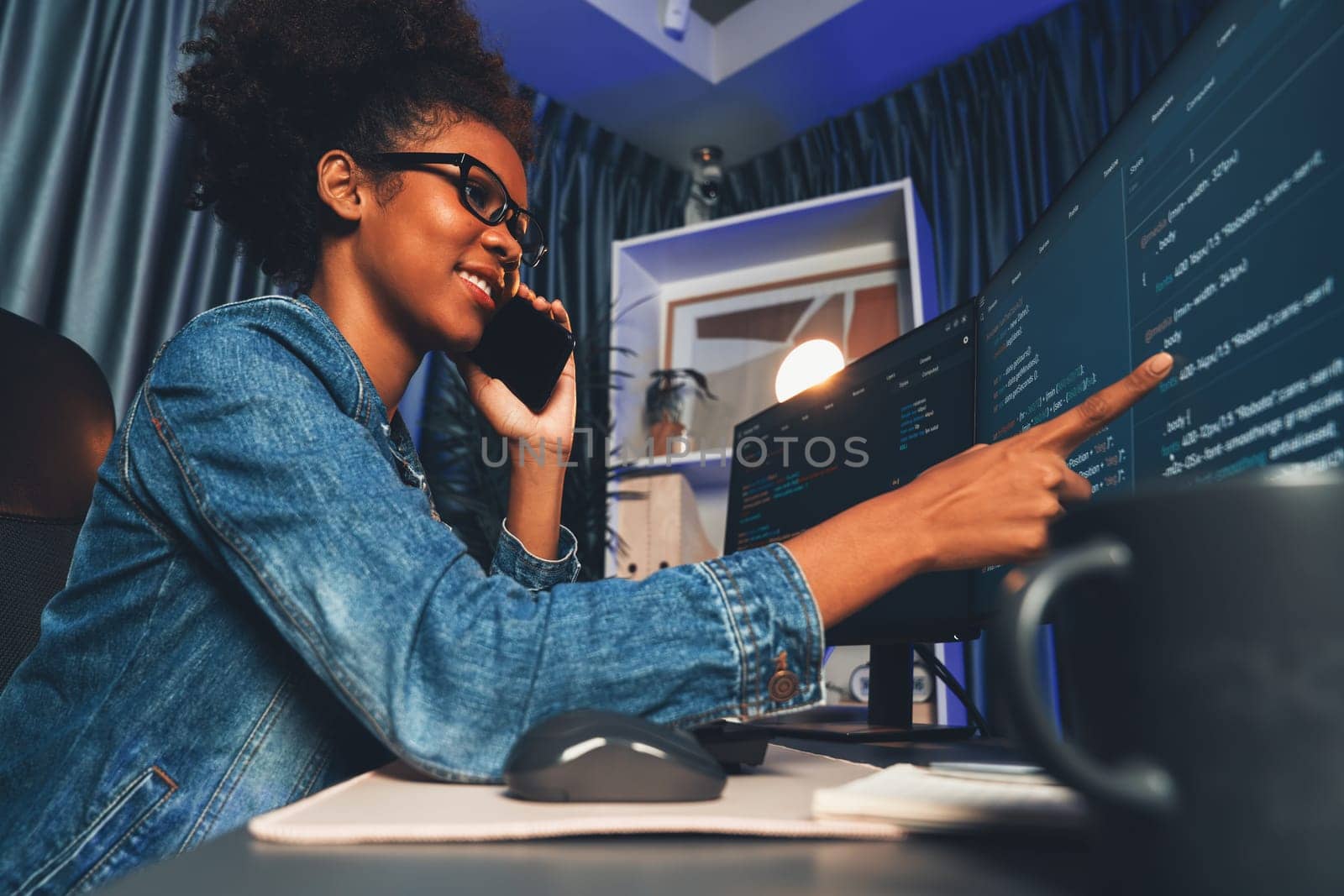 Young African American IT developer concentrating on monitor screen laptop with codding program in data of application and website, Concept of creating innovative html updated version. Tastemaker.