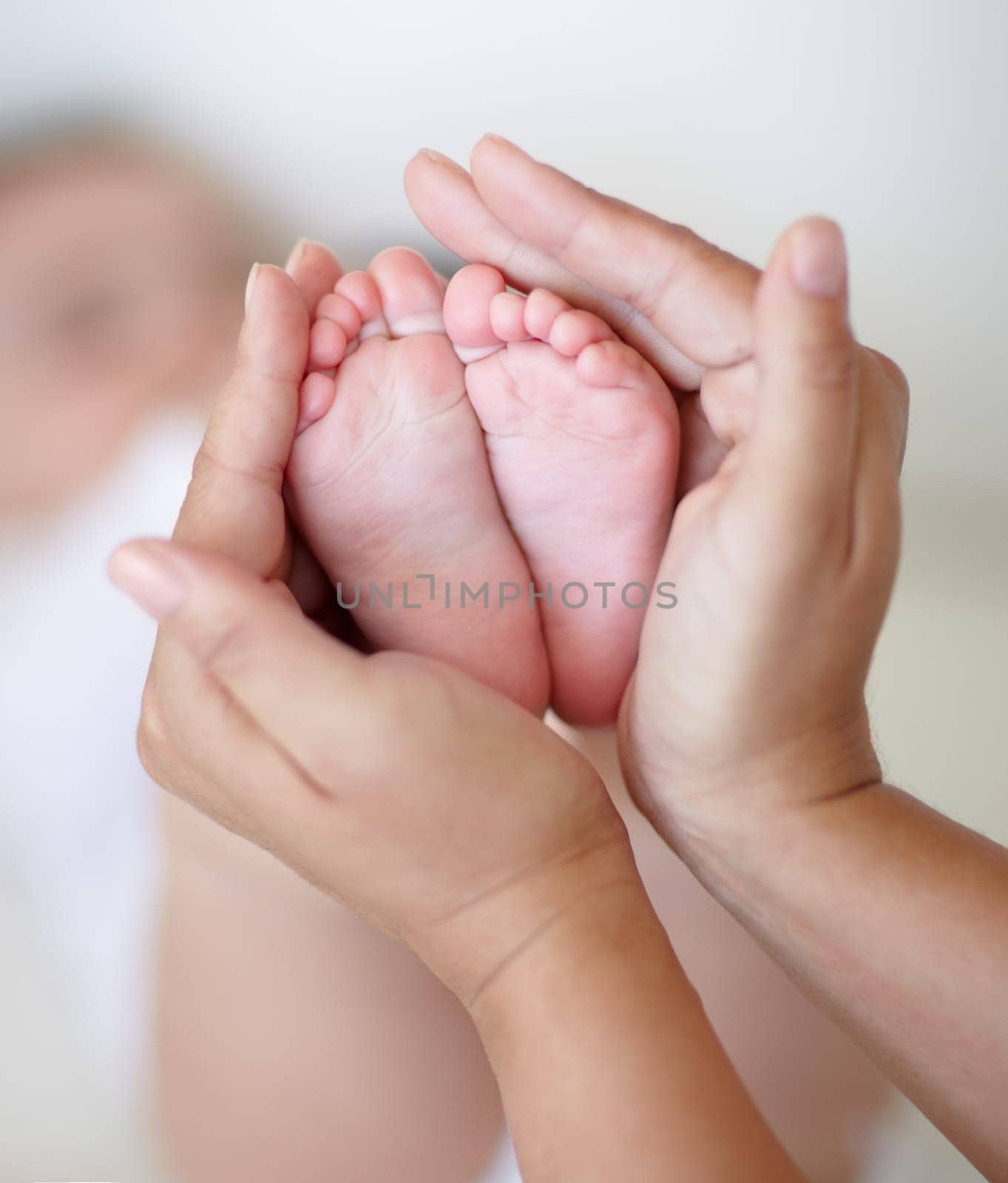 Love, mother and hands with newborn or feet for development, nurture and bonding in nursery of apartment. Family, woman or baby toes with trust, support or care for relationship or motherhood in home by YuriArcurs