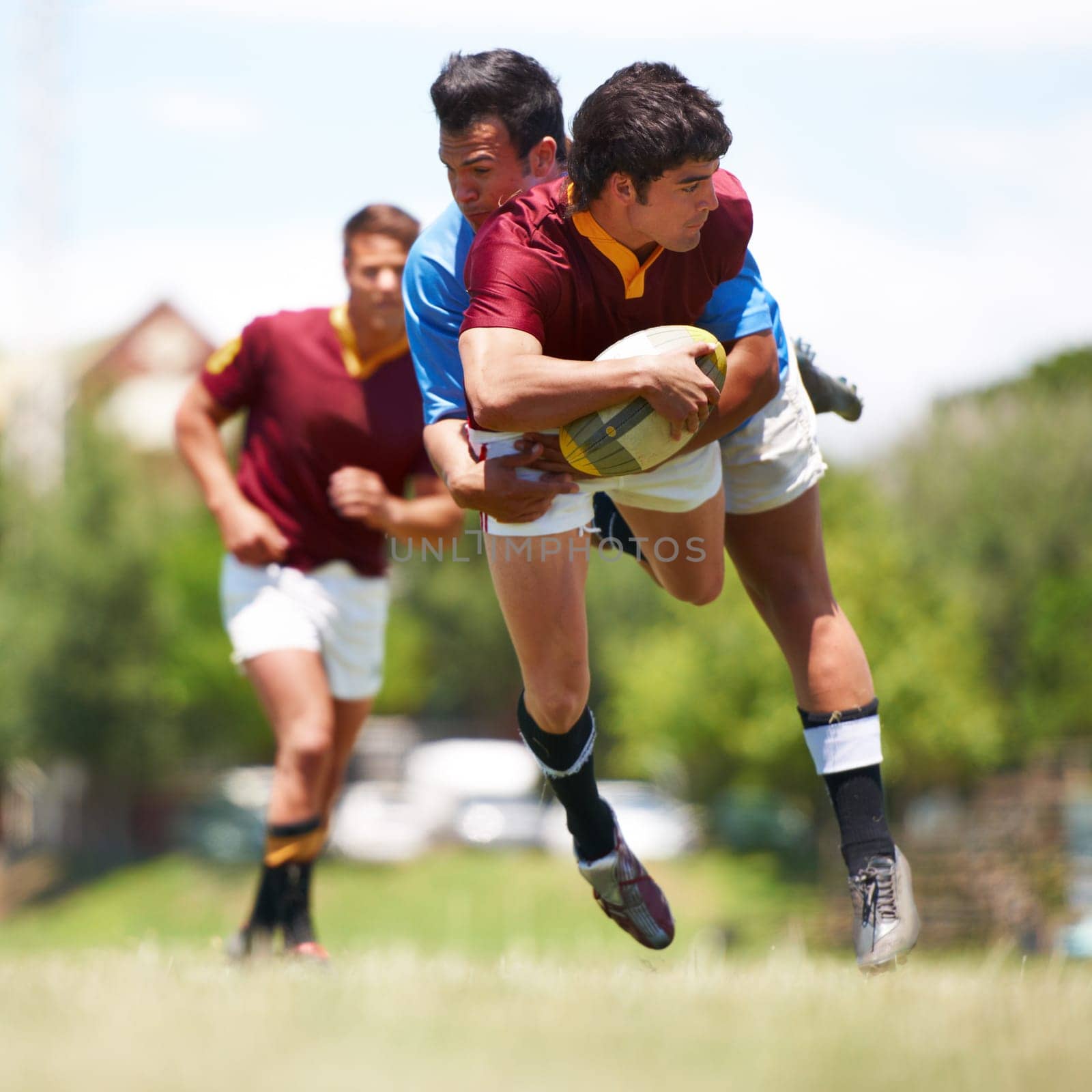 Fitness, tackle and rugby men on a field for sports, ball or action, game or power outdoor. Jump, handball and male team at a park for competitive, training or energy, workout or active challenge.