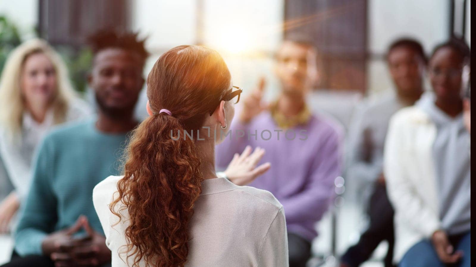 young business woman giving a presentation in a conference room. Back view