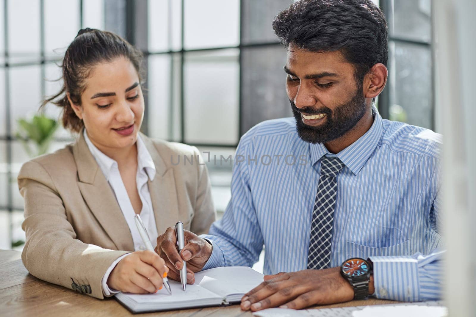 Young account manager advisor lawyer showing paper documents to partner by Prosto