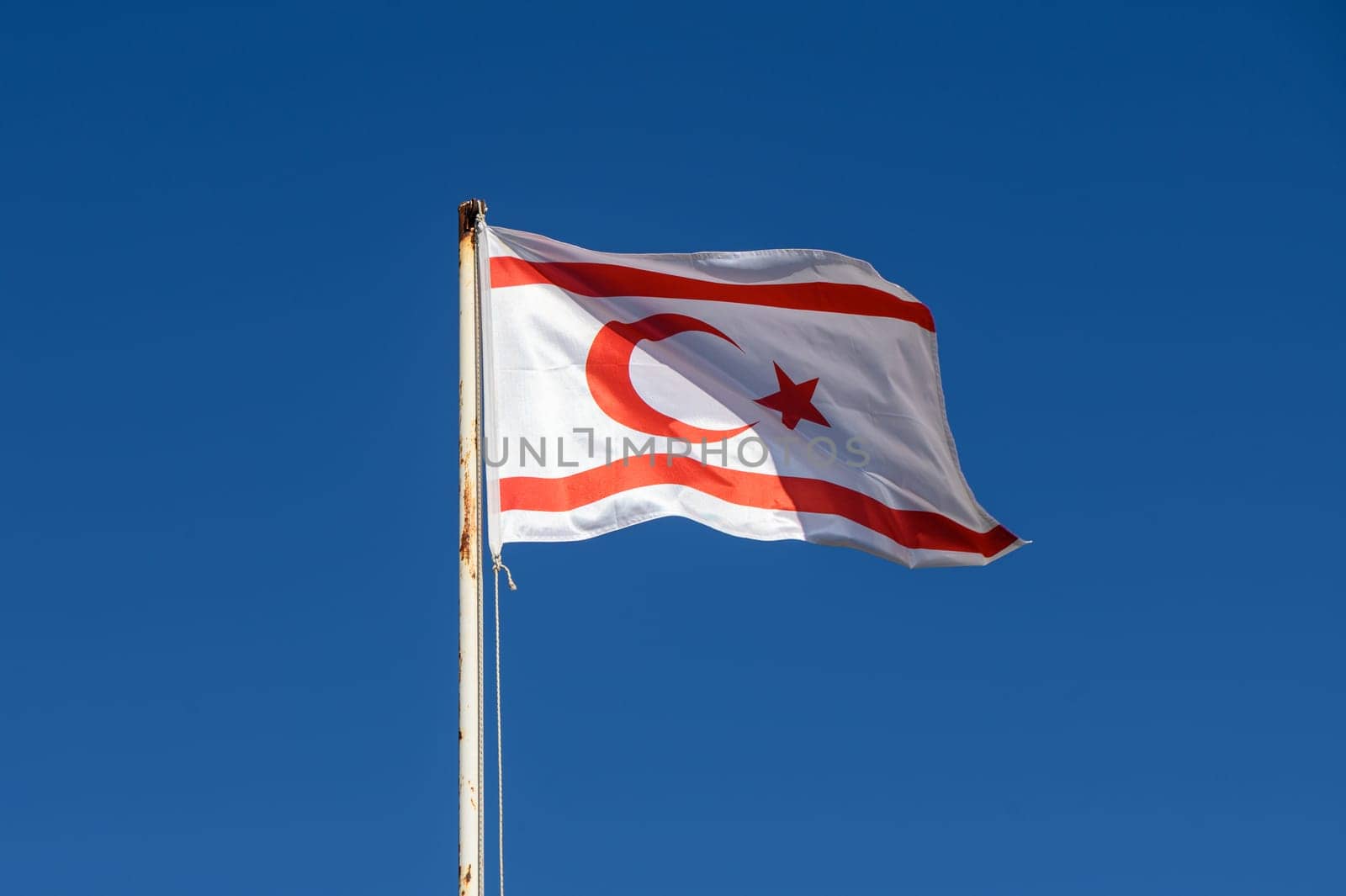 Northern Cyprus flag against blue sky 10