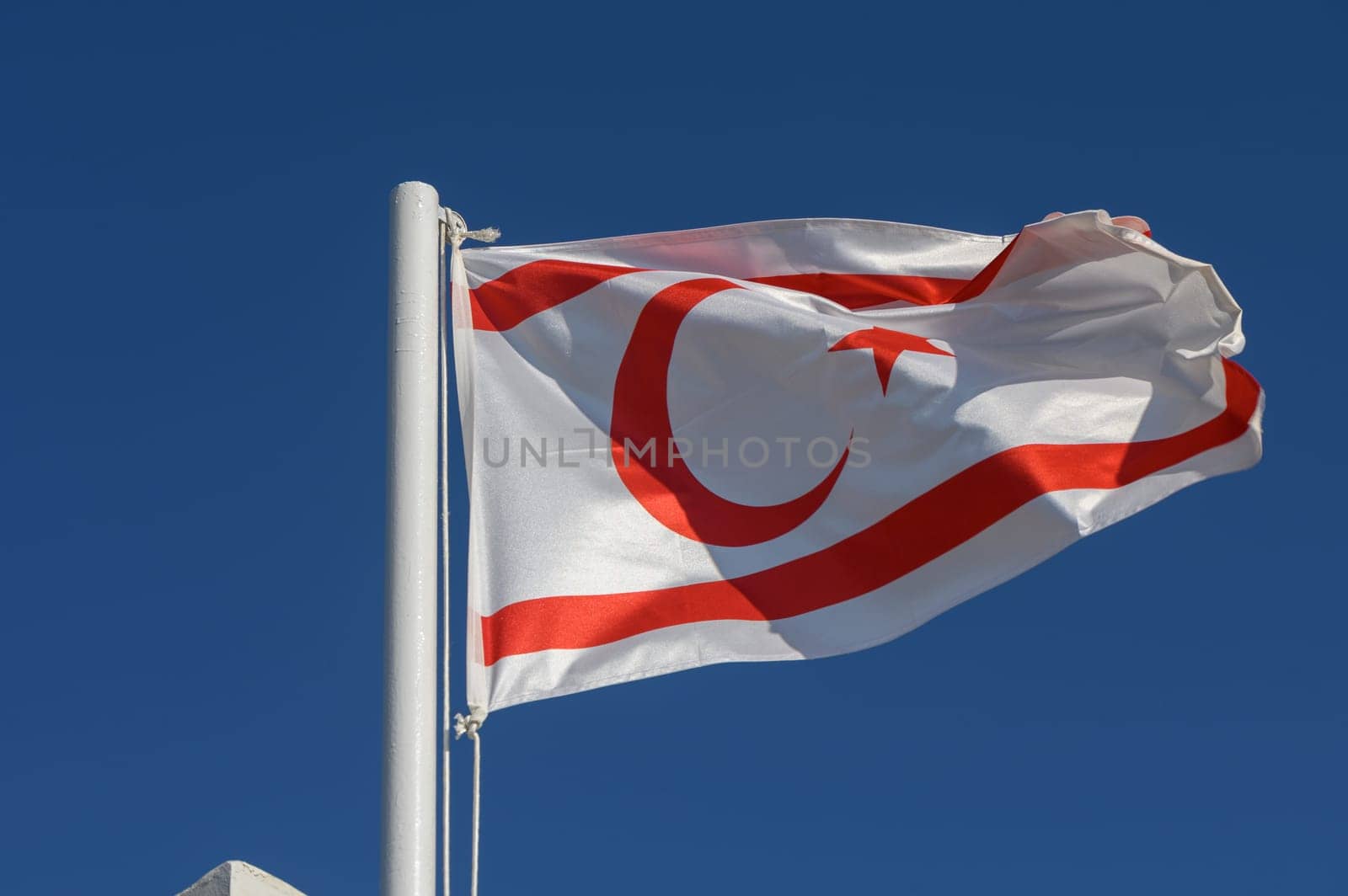 Northern Cyprus flag against blue sky 3 by Mixa74