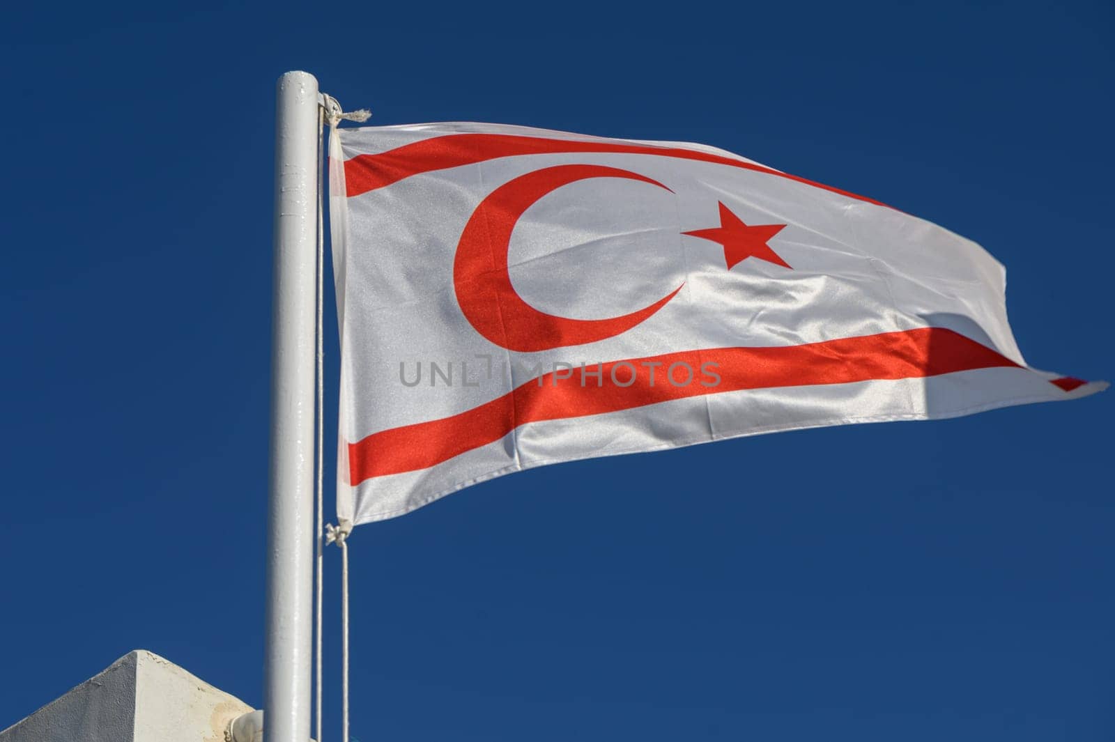 Northern Cyprus flag against blue sky 2 by Mixa74