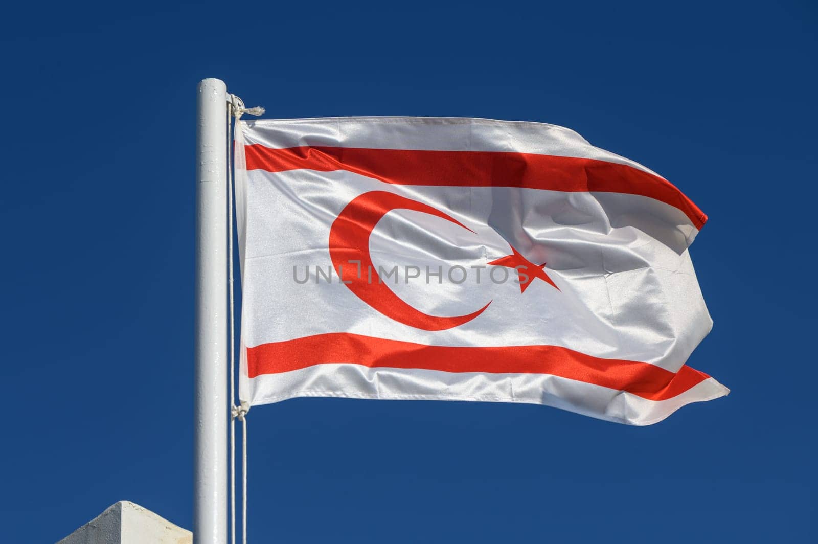 Northern Cyprus flag against blue sky 8