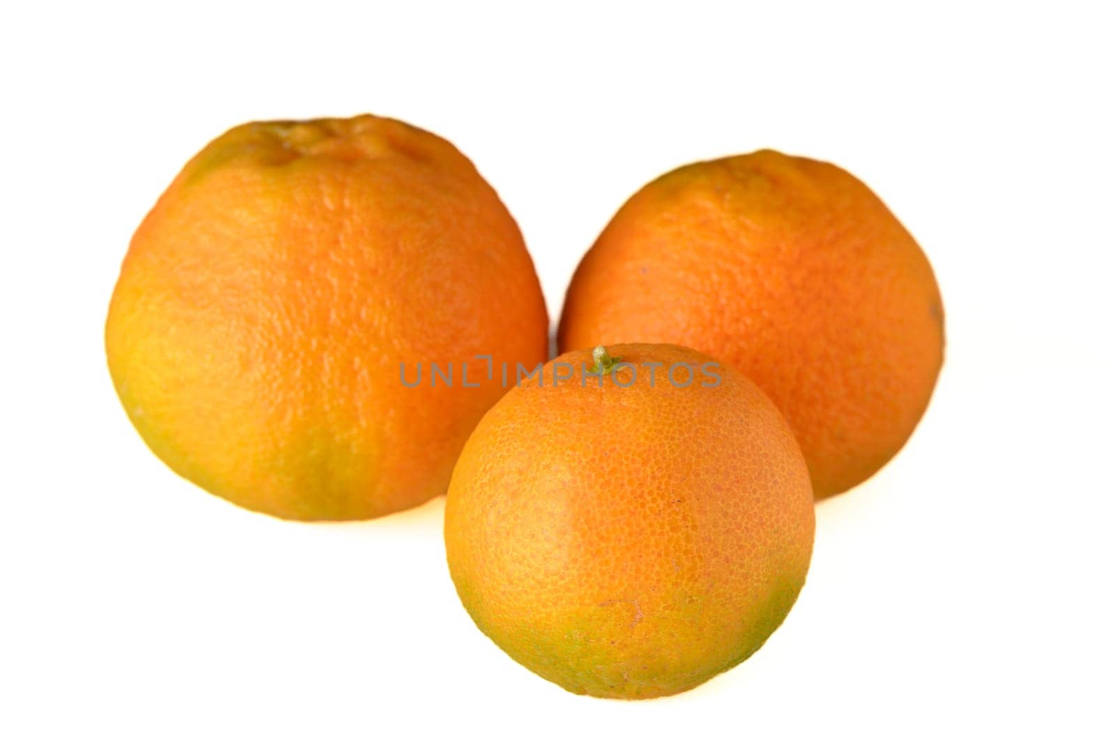 fresh appetizing 3 tangerines on a white background