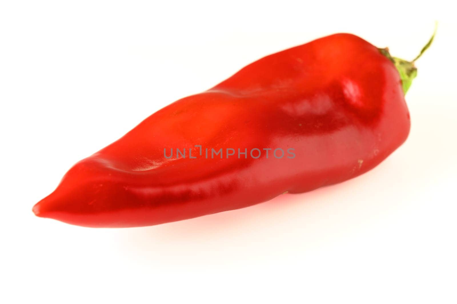 fresh appetizing red sweet pepper on a white background