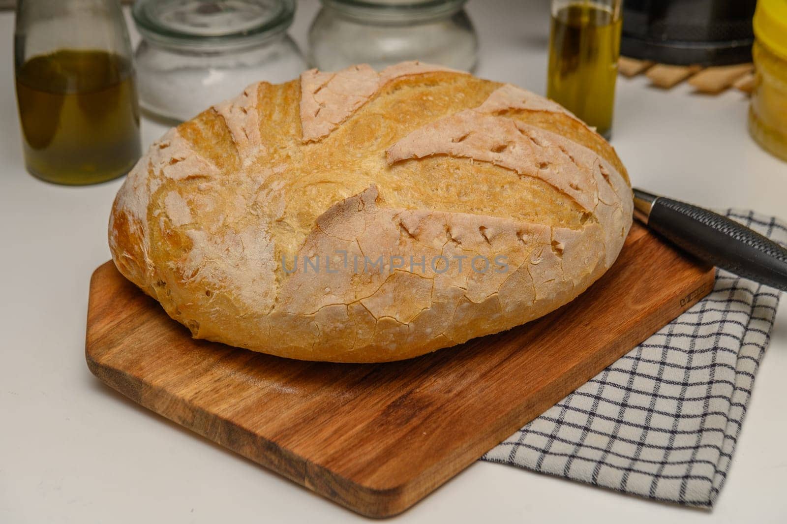 freshly baked homemade bread on the kitchen table on a light background 1