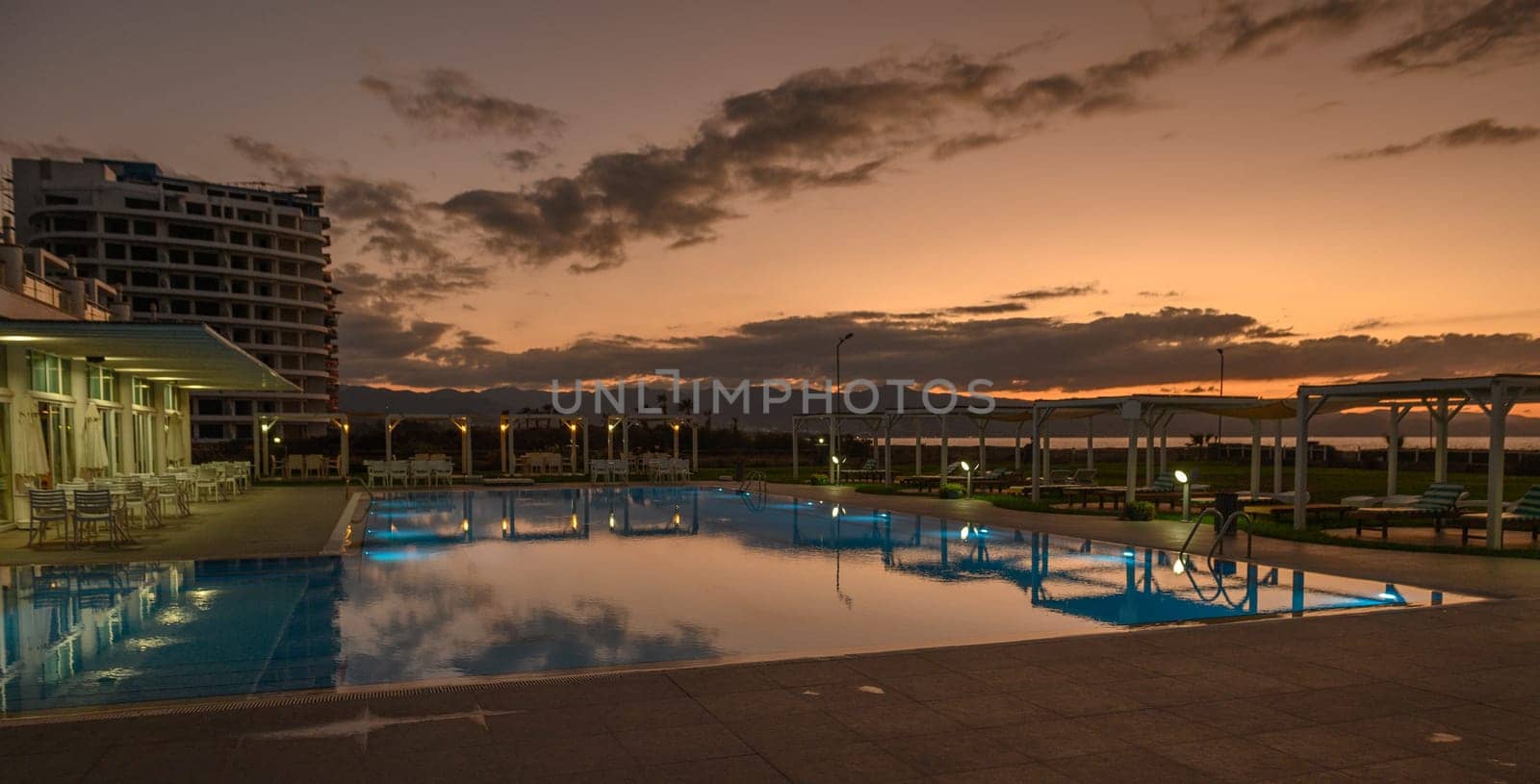 swimming pool in a residential complex in the sunset light