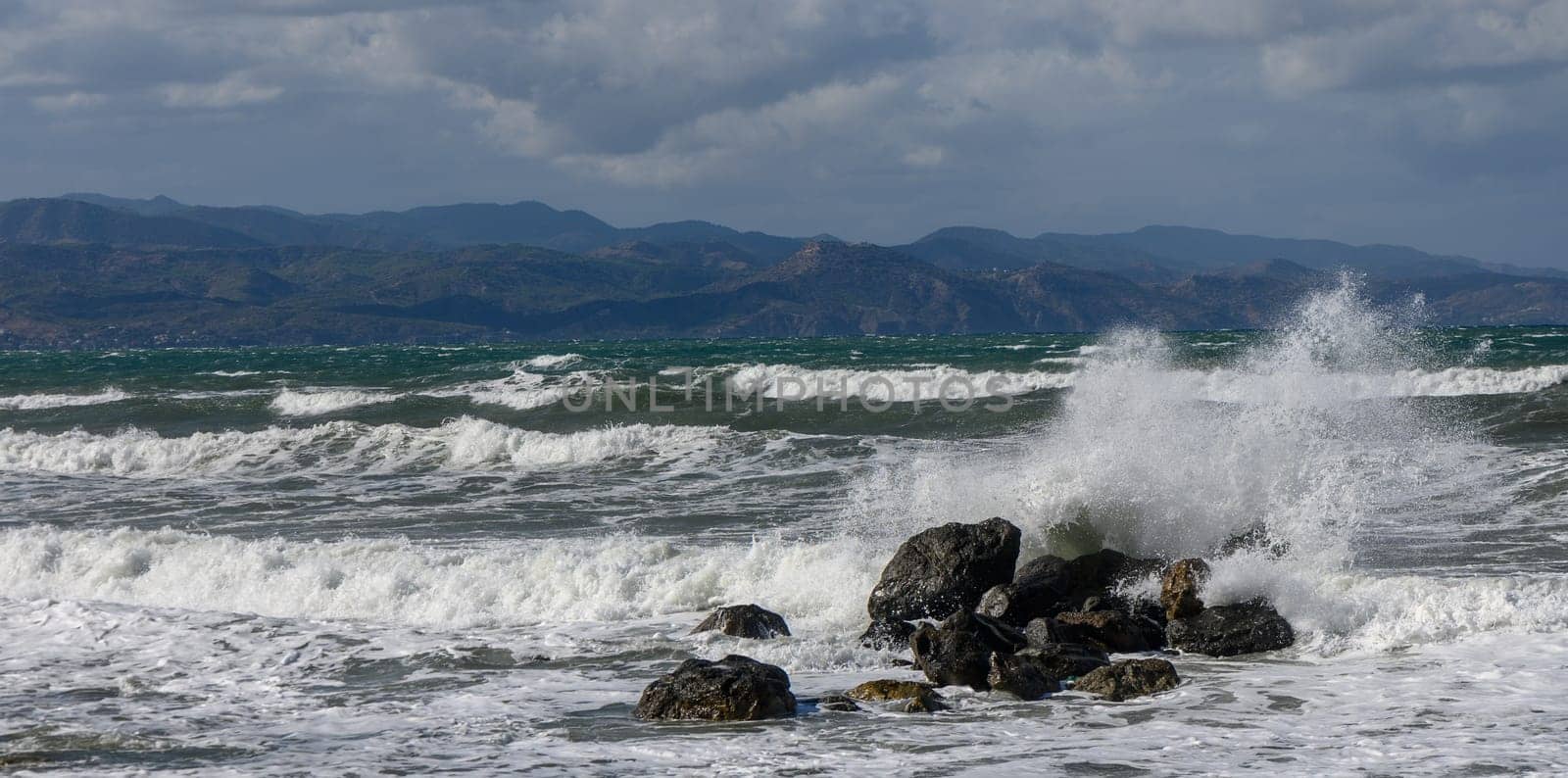 waves break on a stone in the Mediterranean Sea in autumn on the island of Cyprus 2