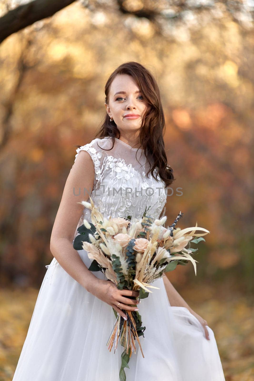 beautiful happy bride holding wedding autumn bouquet by erstudio
