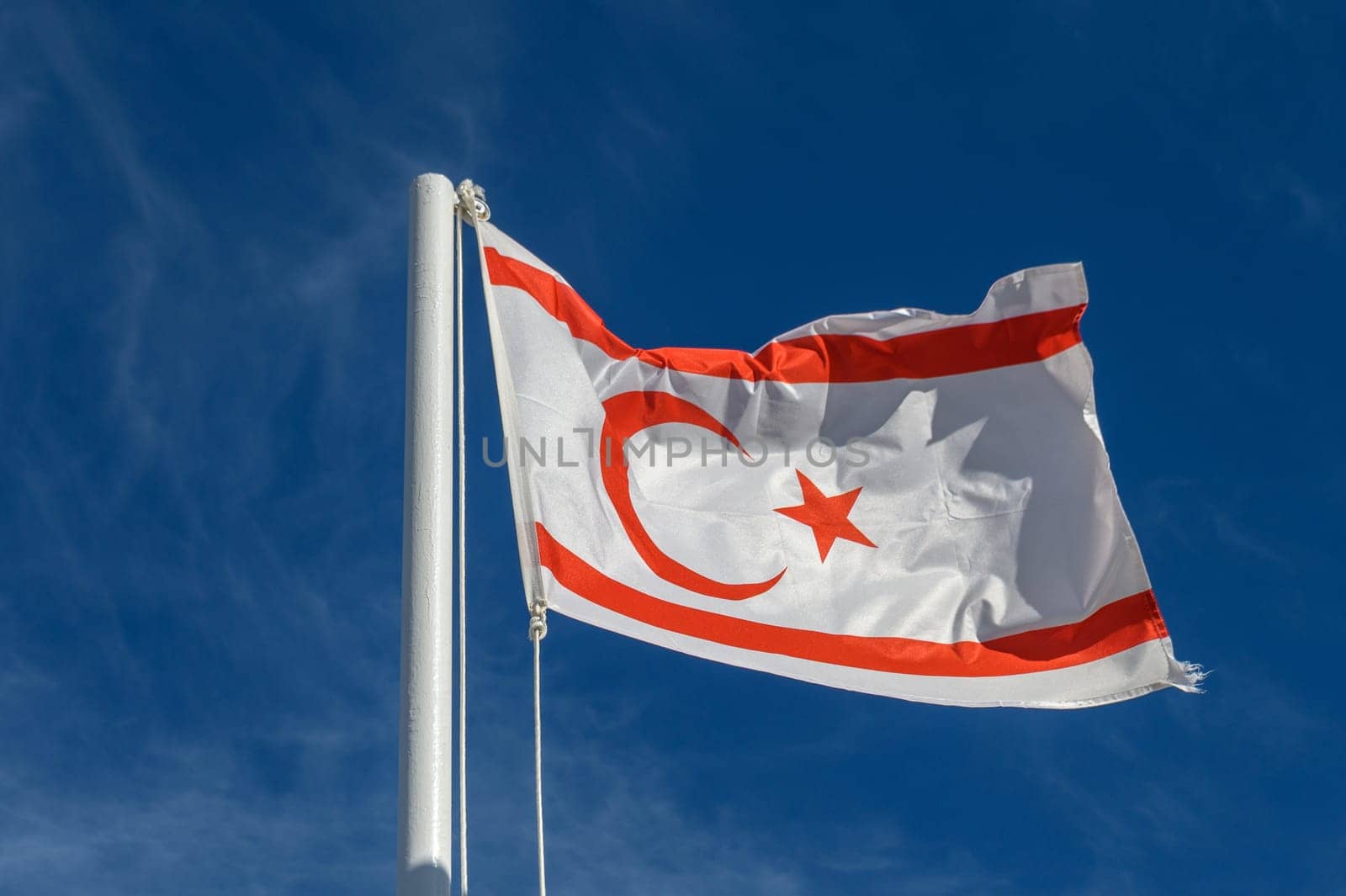 flag of the Turkish Republic of Northern Cyprus against a blue sky 1 by Mixa74