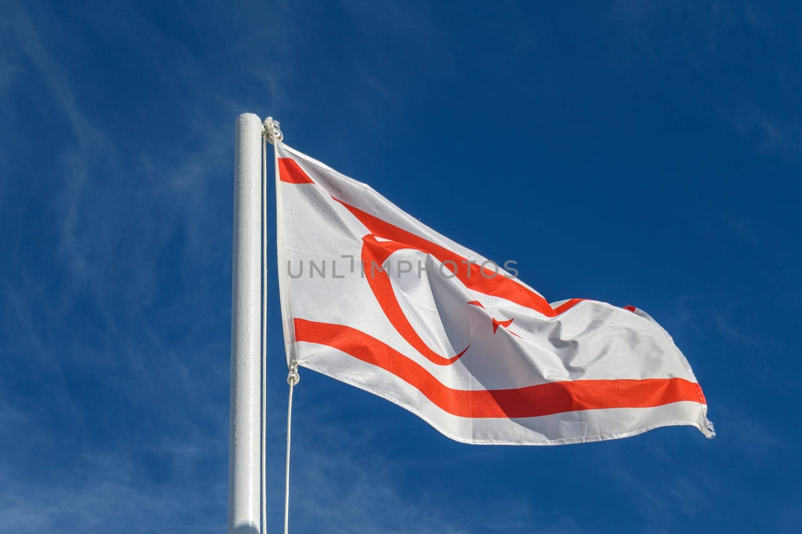 flag of the Turkish Republic of Northern Cyprus against a blue sky 2