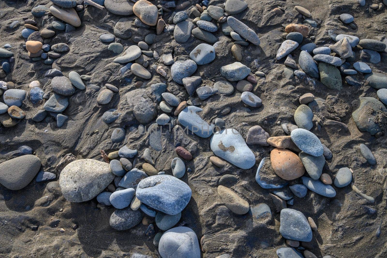 sea ​​pebbles on the sand of the beach 1