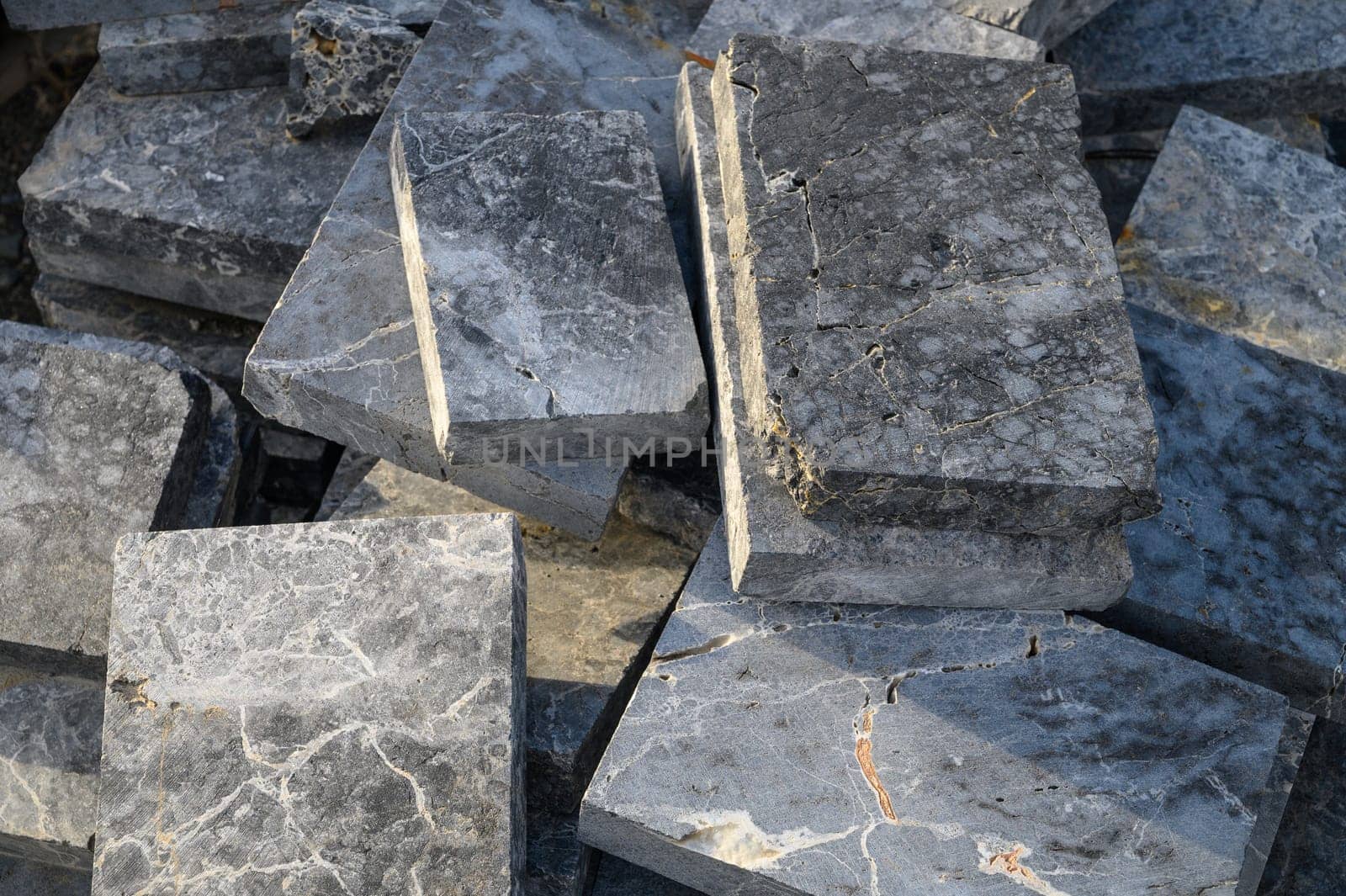 pieces of stone for paving lie in a heap as a background 13 by Mixa74