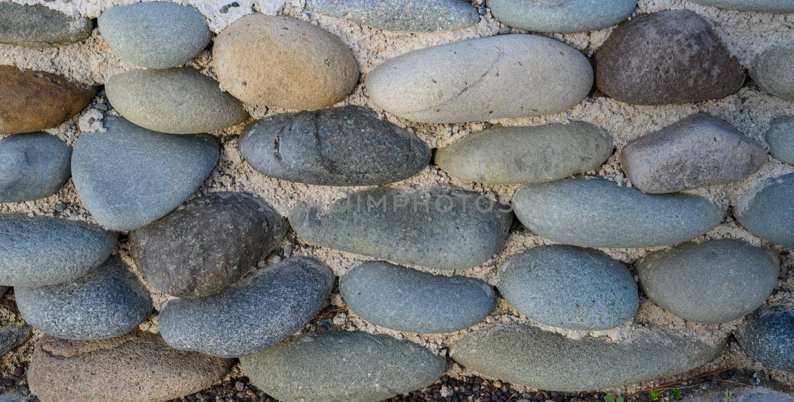 sea ​​pebbles with concrete as background 2