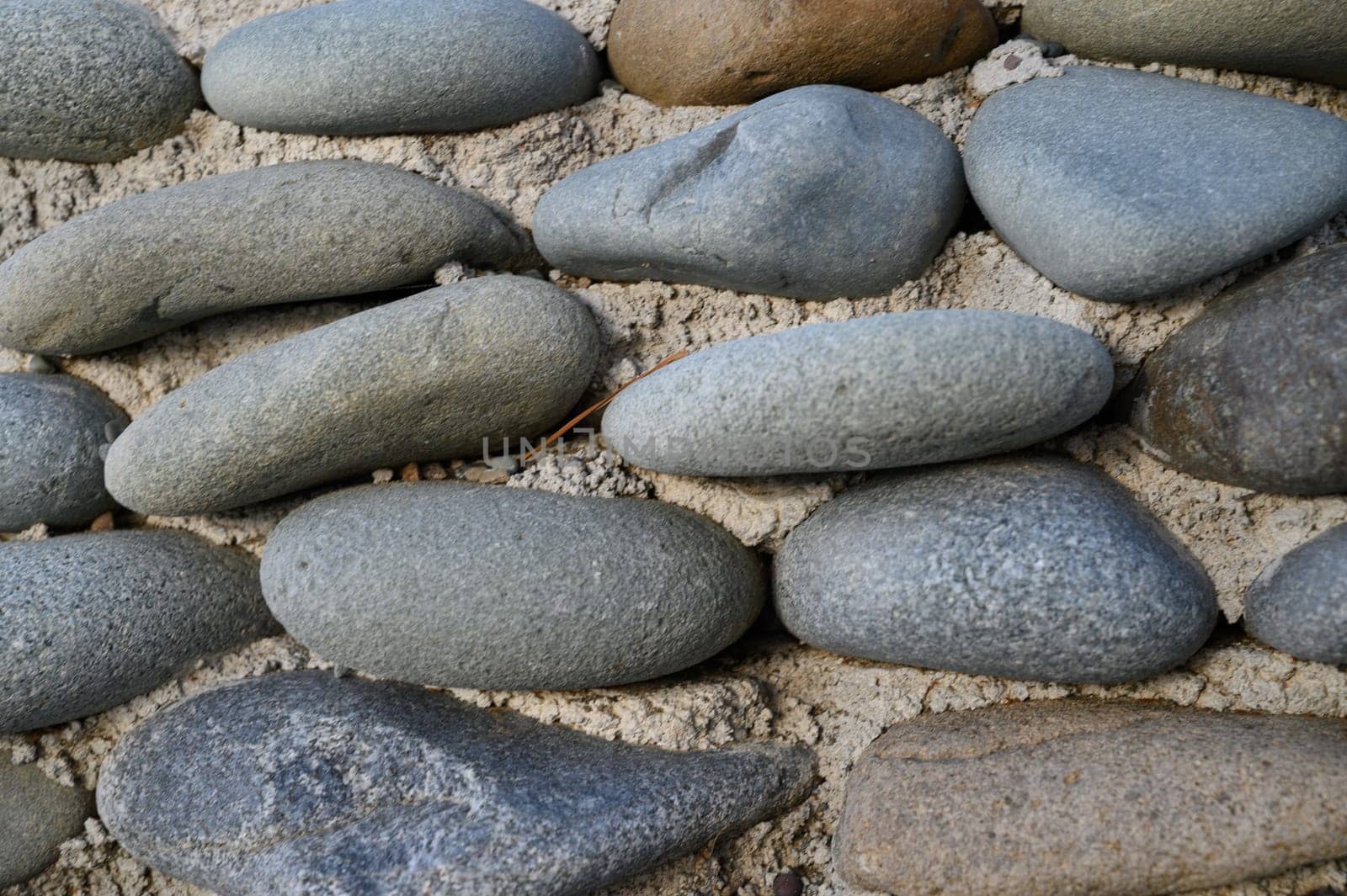 sea ​​pebbles with concrete as background 1 by Mixa74