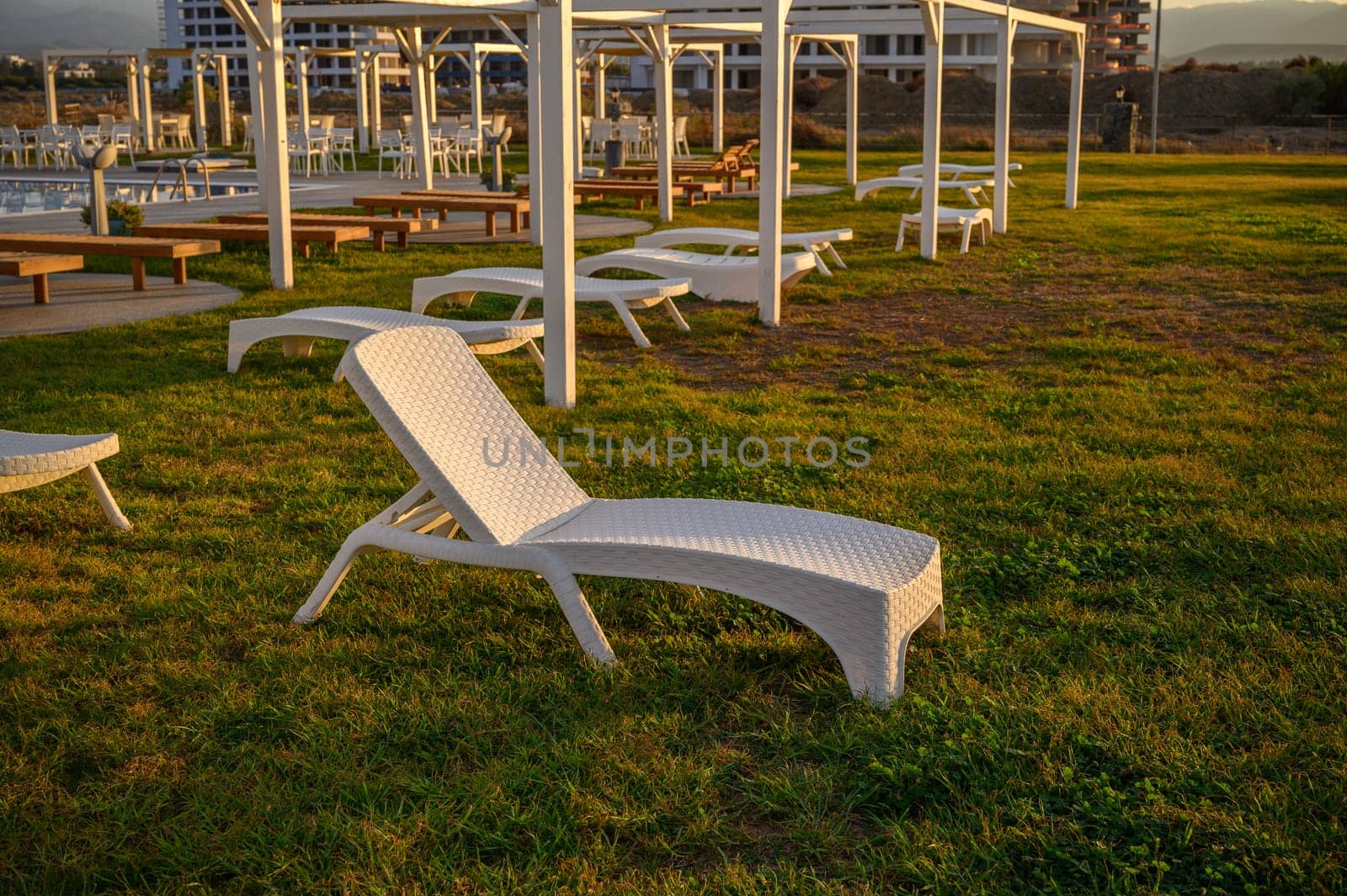 white plastic sun loungers on the Mediterranean sea 6 by Mixa74