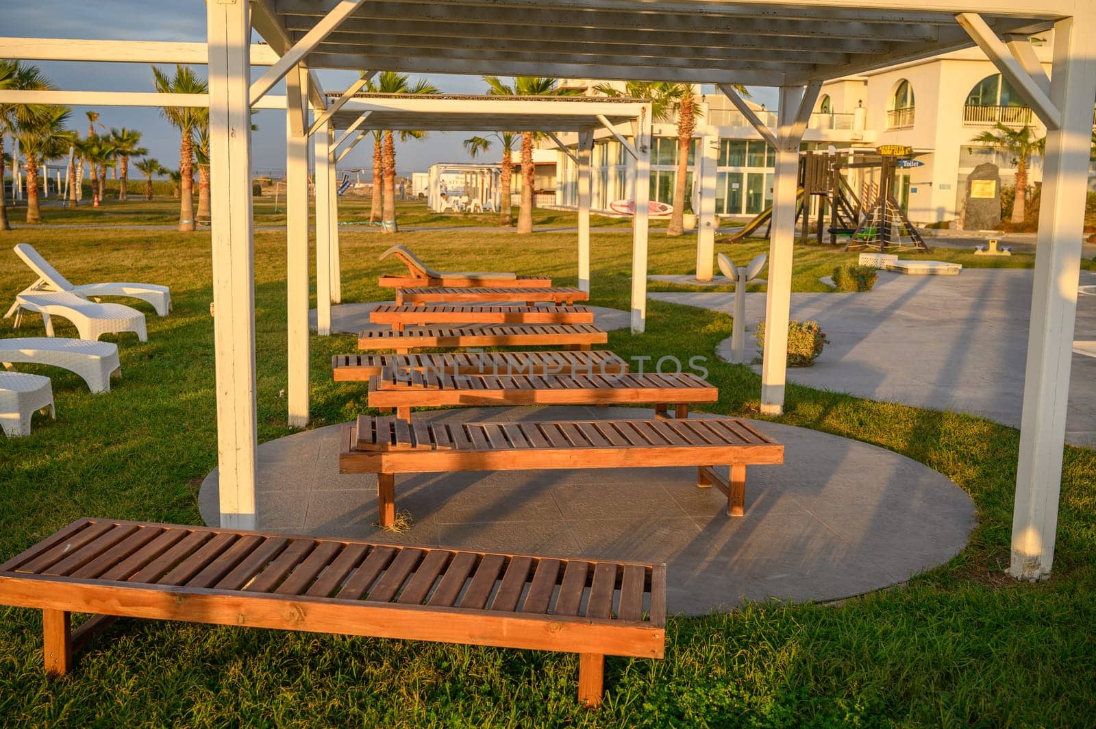 wooden sun loungers on the Mediterranean sea