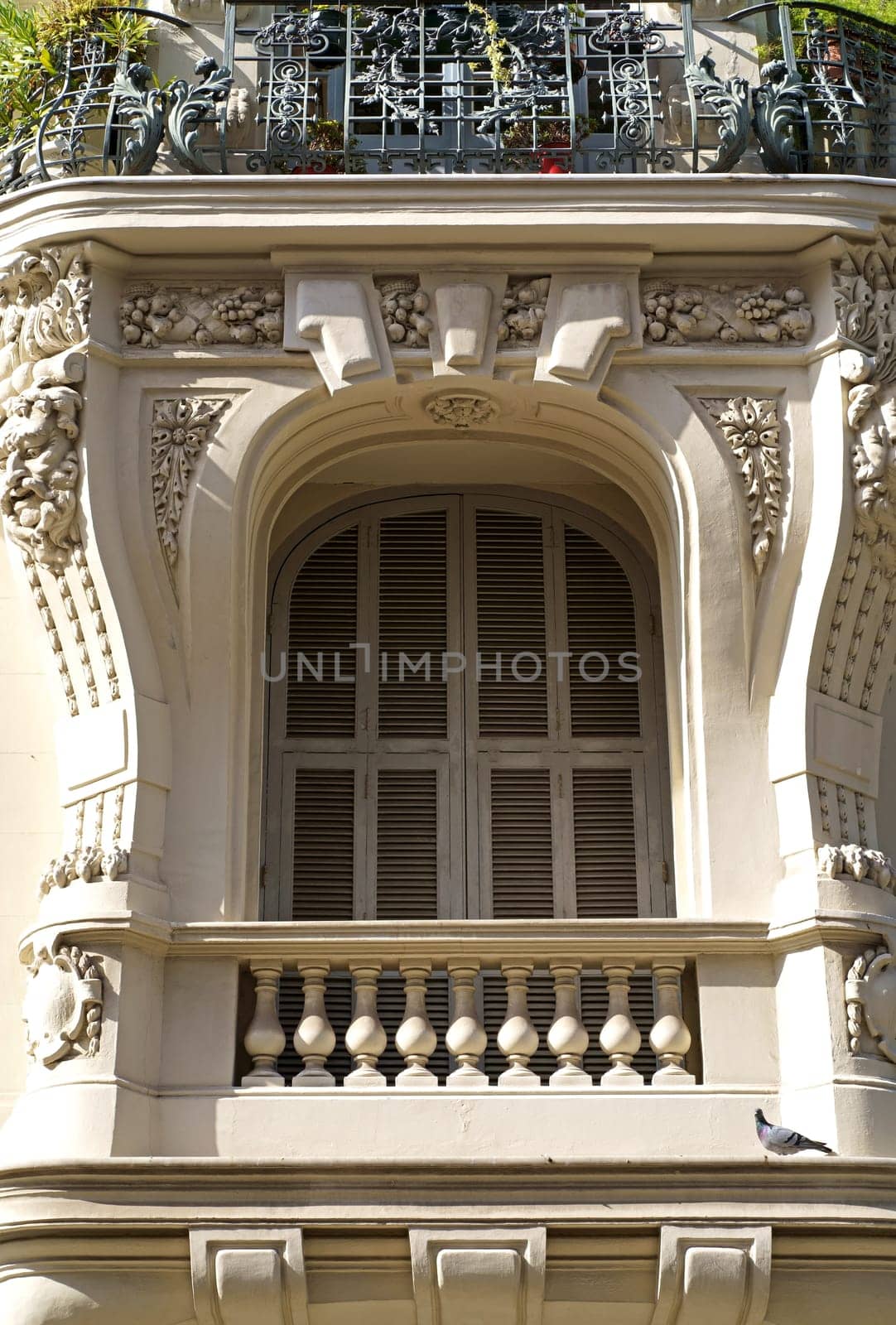beautiful windows with shutters . Beautiful wooden window shutter with windowsill, cement wall and sunny day by aprilphoto