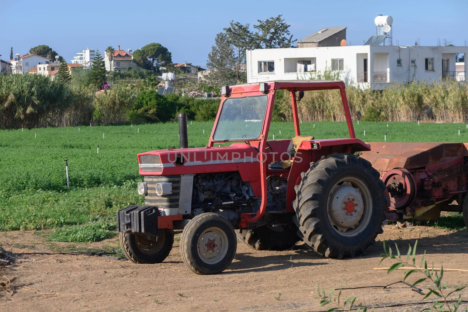 old red tractor in the garden