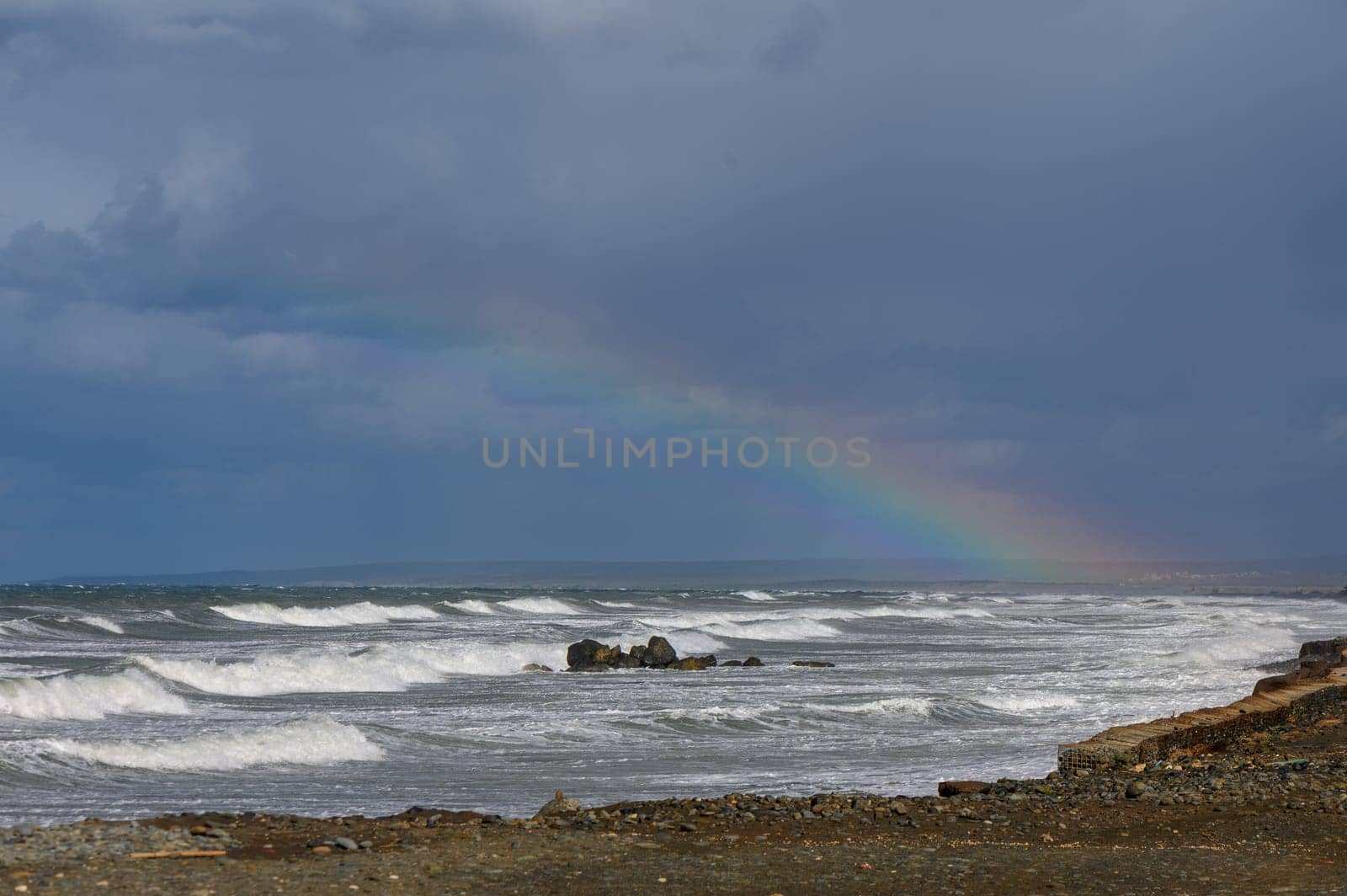 rainbow over the Mediterranean sea during a storm