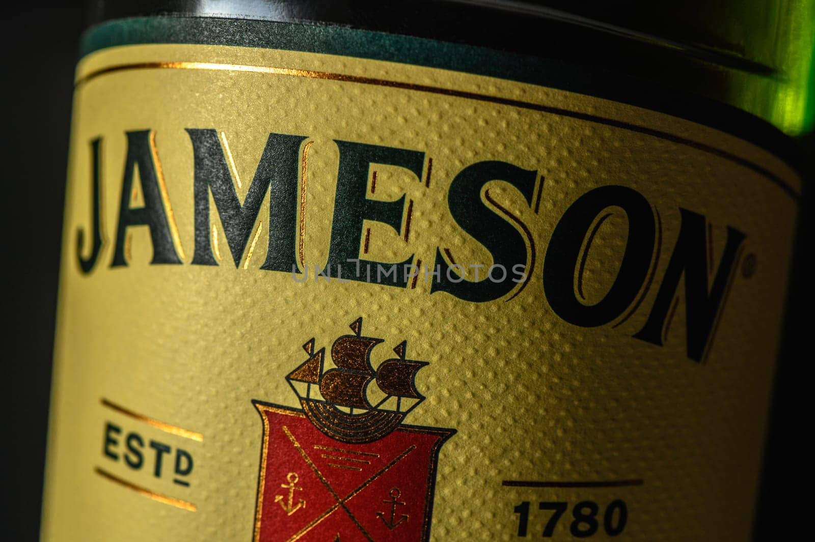 Ukraine, Chernigov 18/11/2023 - Bottle of Jameson whiskey on a black background, beautiful color of whiskey 2 by Mixa74
