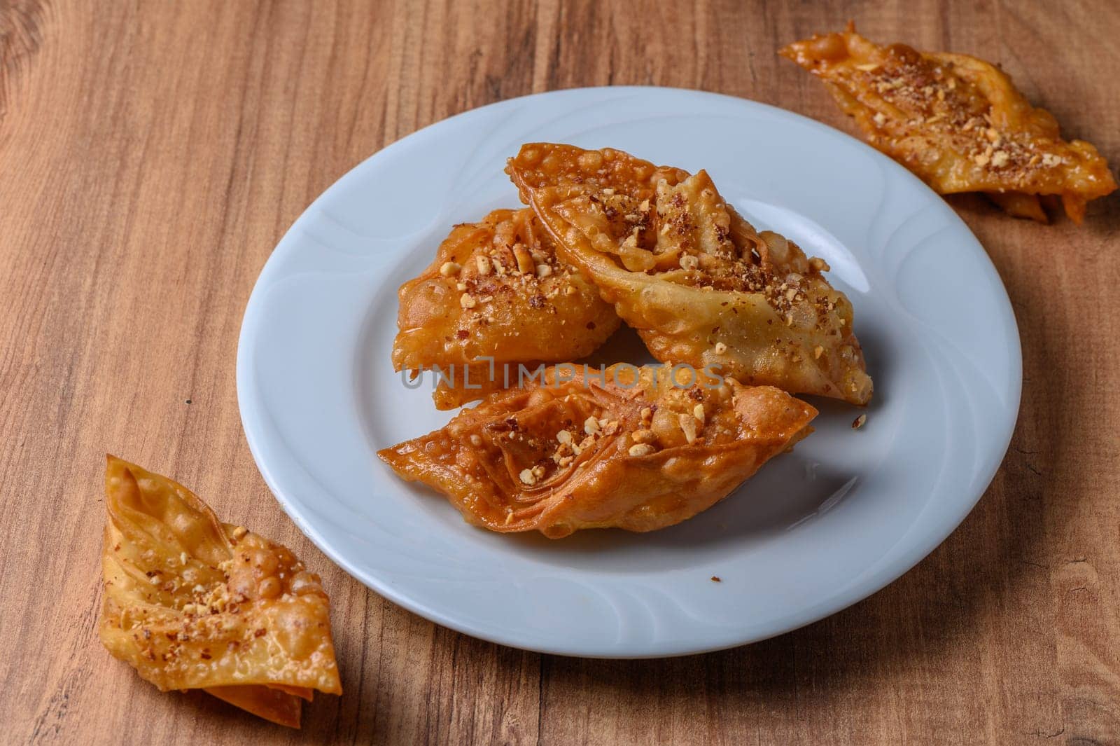 Turkish baklava, sweet dessert with honey on a light plate 2