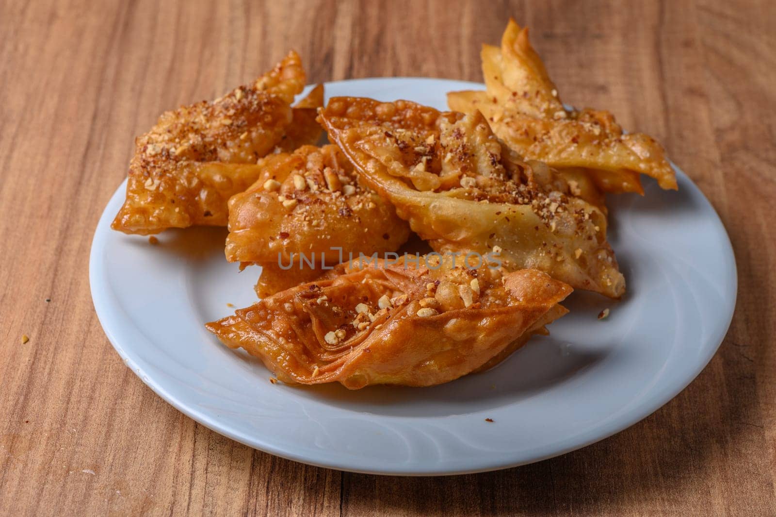 Turkish baklava, sweet dessert with honey on a light plate 4 by Mixa74