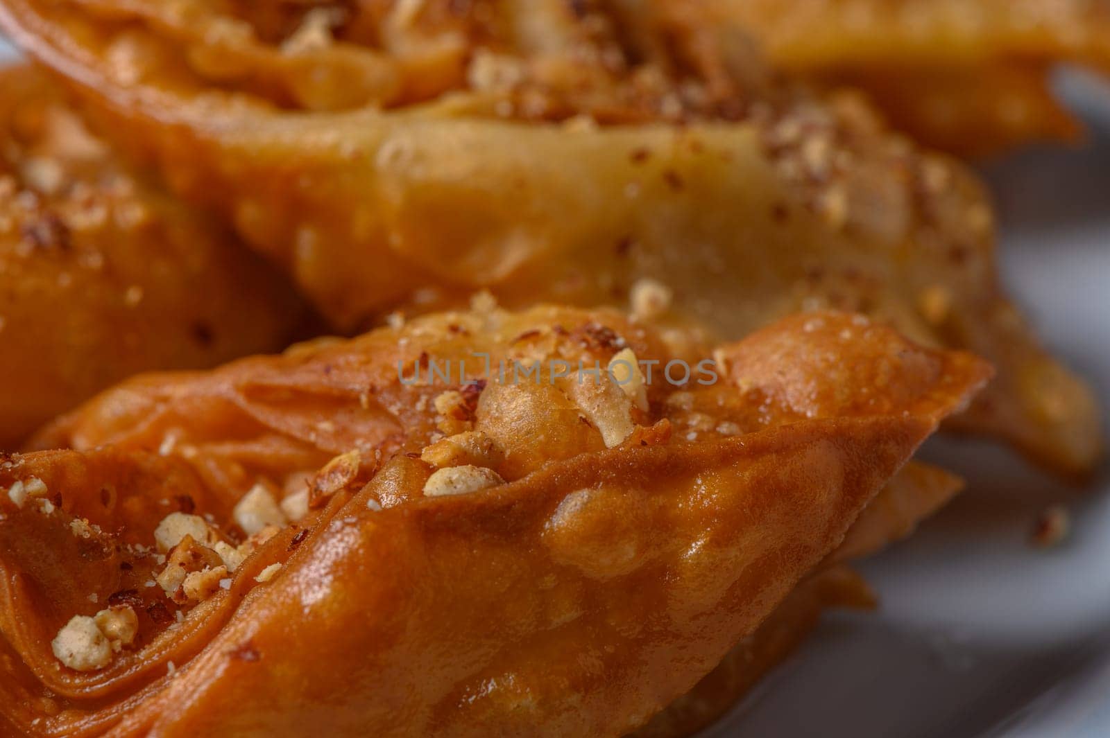 Turkish baklava, sweet dessert with honey on a light plate 6 by Mixa74