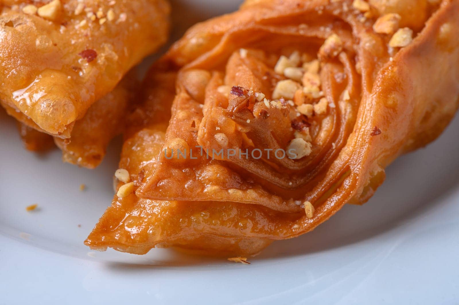 Turkish baklava, sweet dessert with honey on a light plate 9