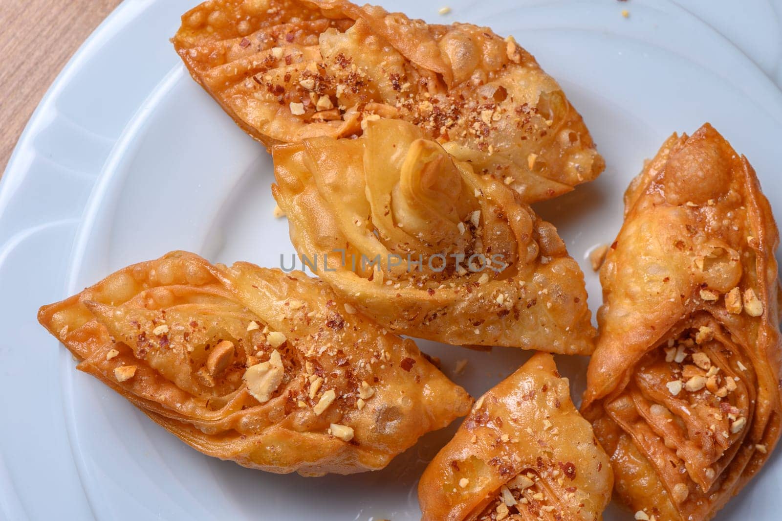 Turkish baklava, sweet dessert with honey on a light plate 16