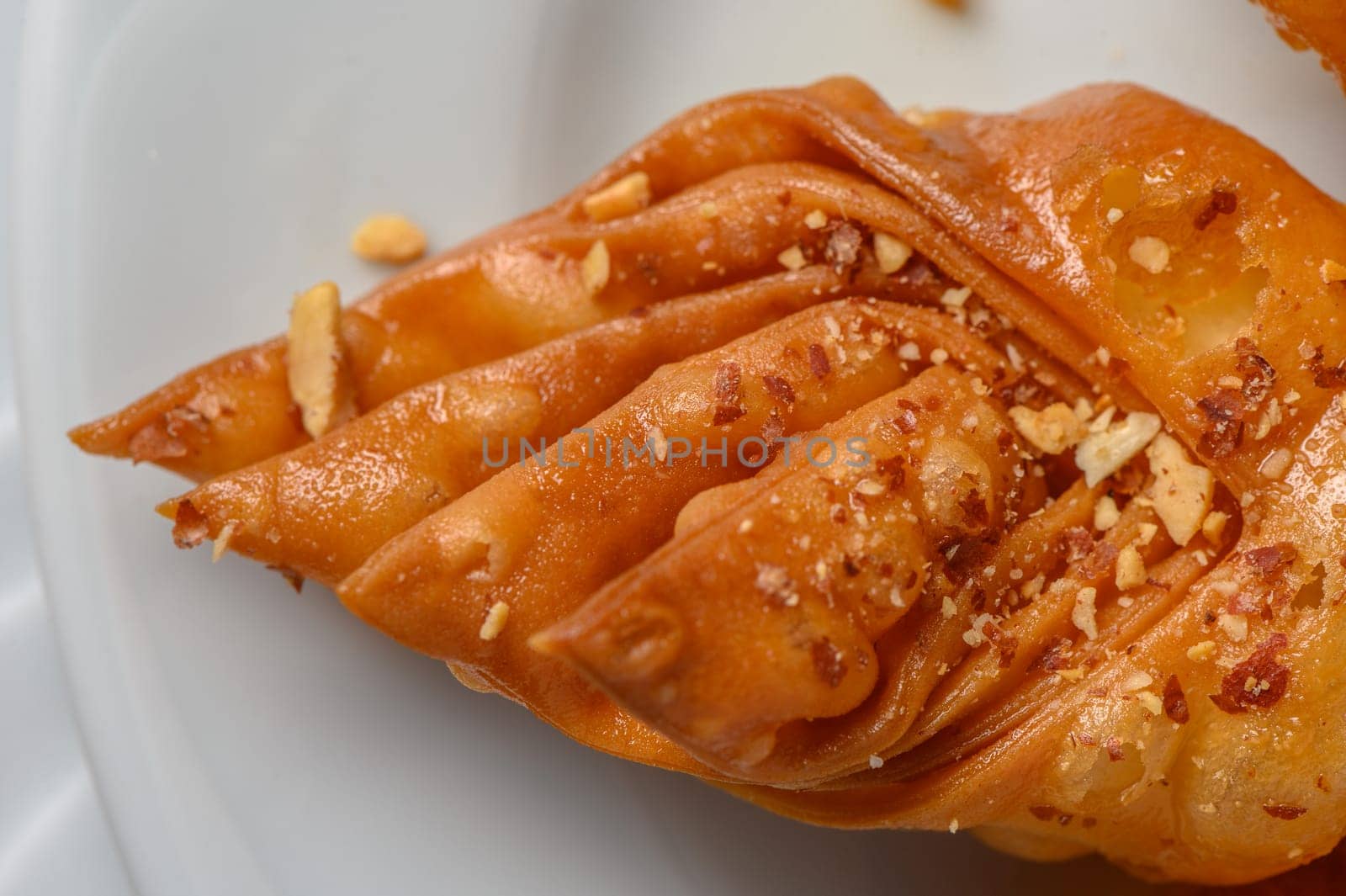 Turkish baklava, sweet dessert with honey on a light plate 18