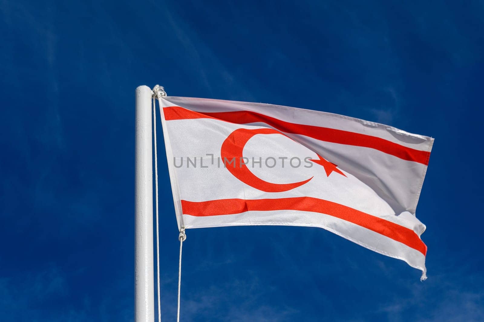 flag of the Turkish Republic of Northern Cyprus against a blue sky 7 by Mixa74