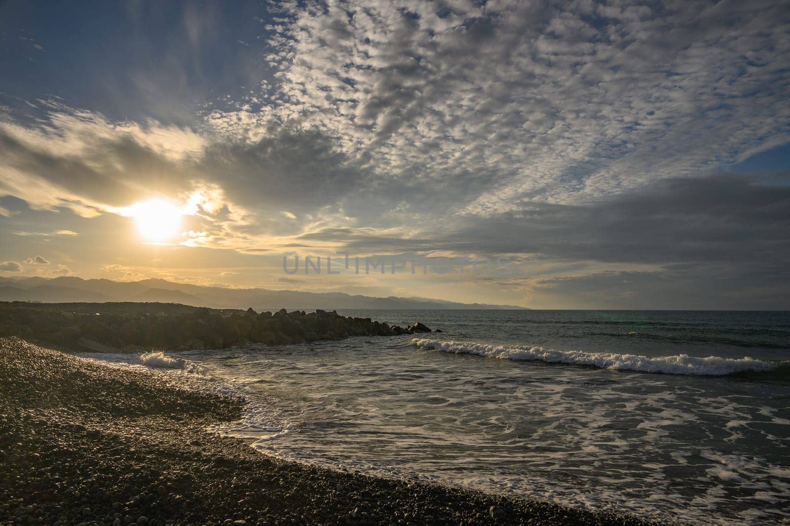 evening sun over mountains and Mediterranean sea