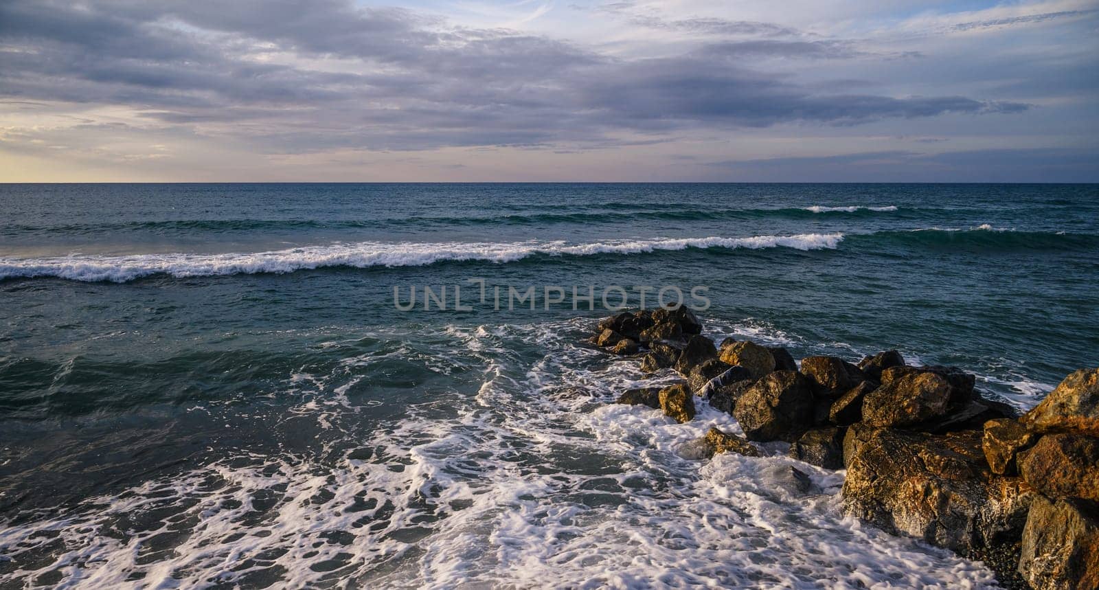 waves stones in the sea on the Mediterranean in winter