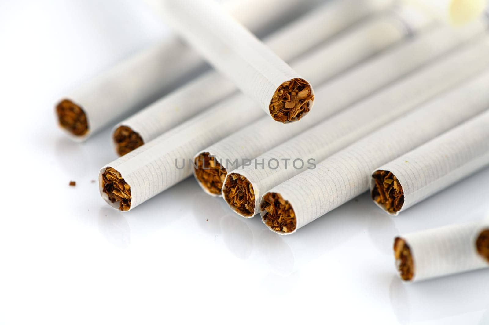 laid out cigarettes on a white background 2