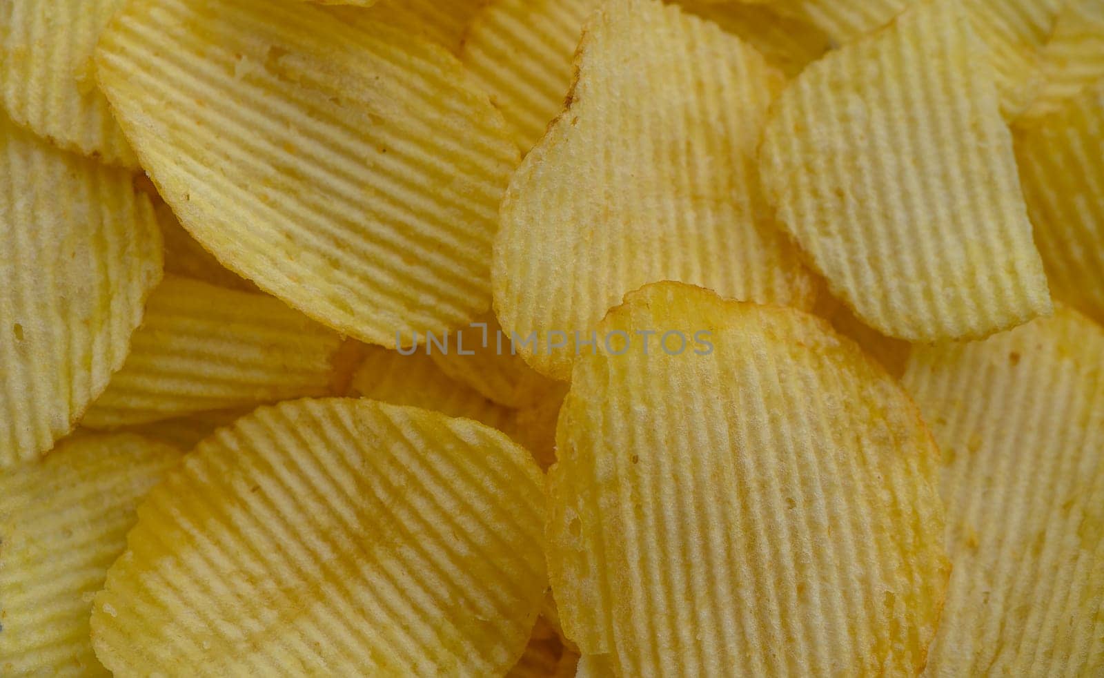 food background, delicious potato chips laid out on the table 2