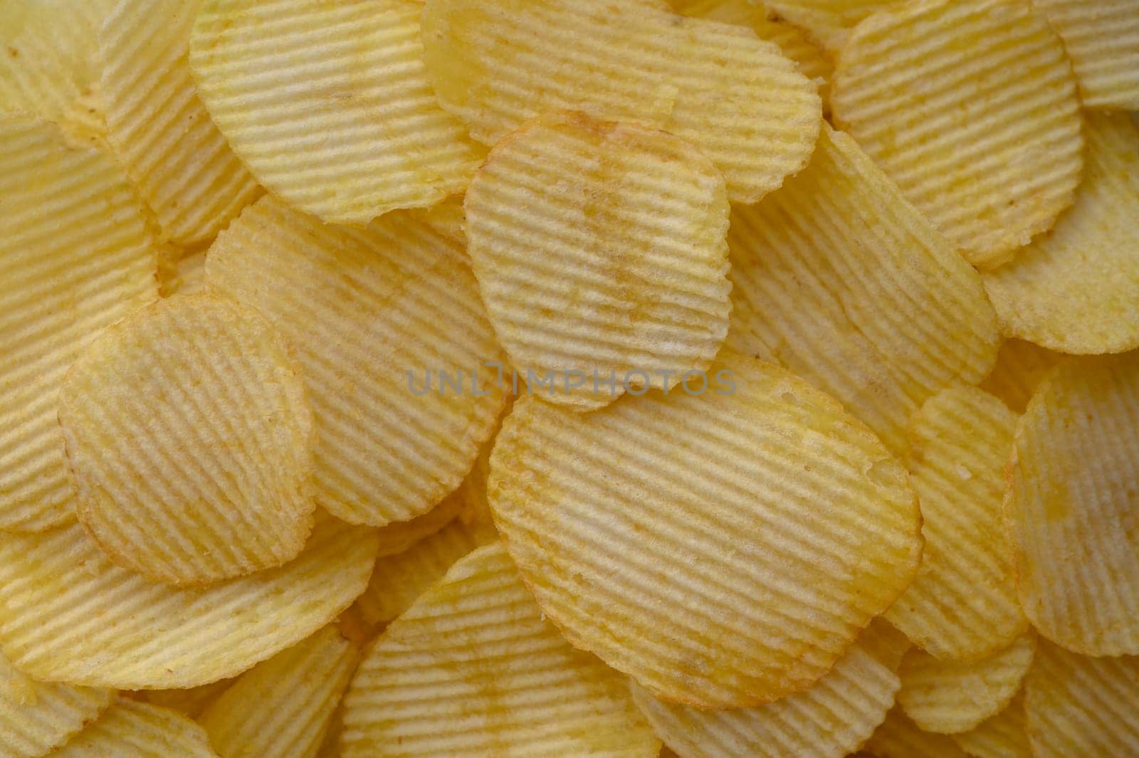 food background from delicious chips poured out of a pack 3