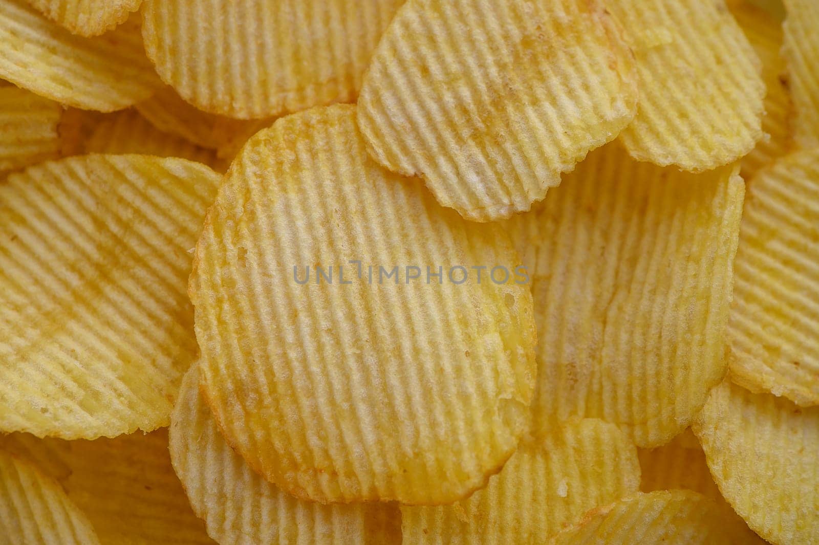 food background from delicious chips poured out of a pack 3 by Mixa74