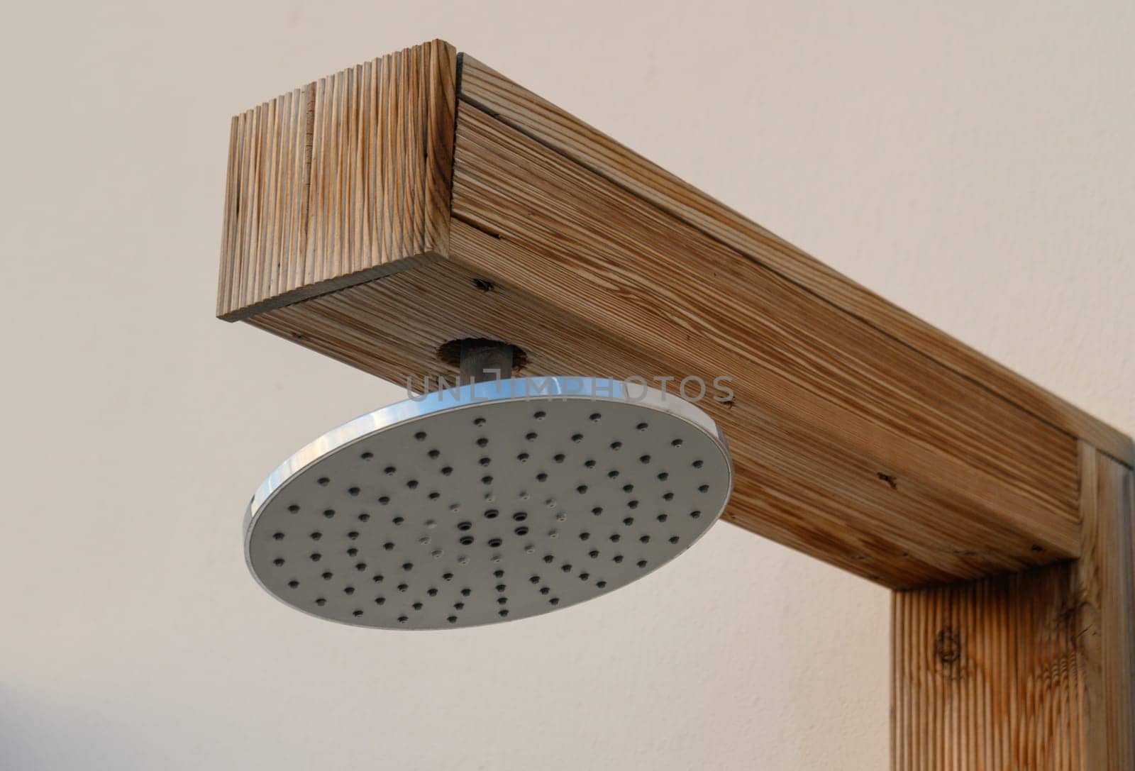 shower head near the pool on the street in a residential complex