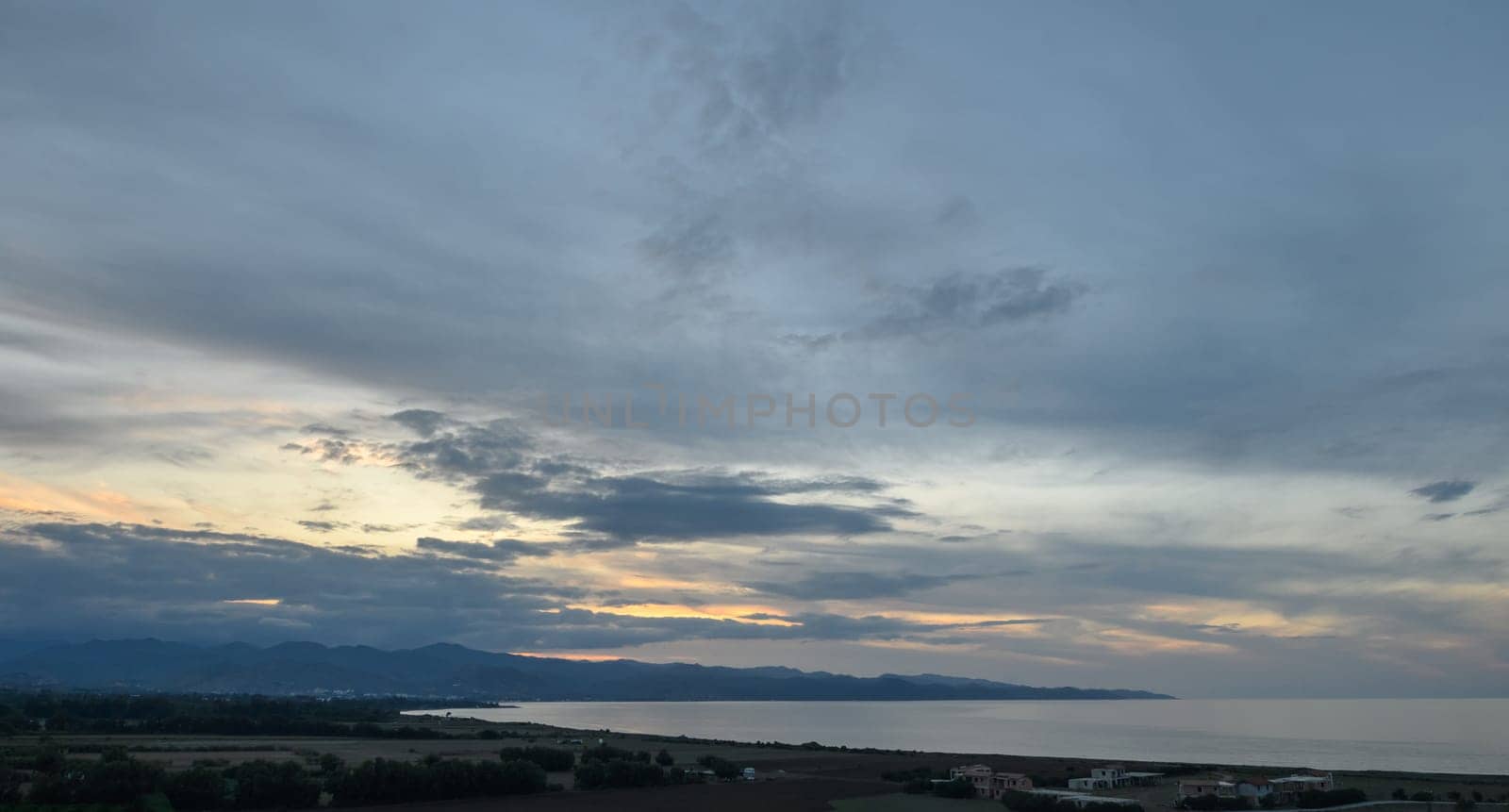 blue sunset sky with clouds over the Mediterranean sea in winter 2