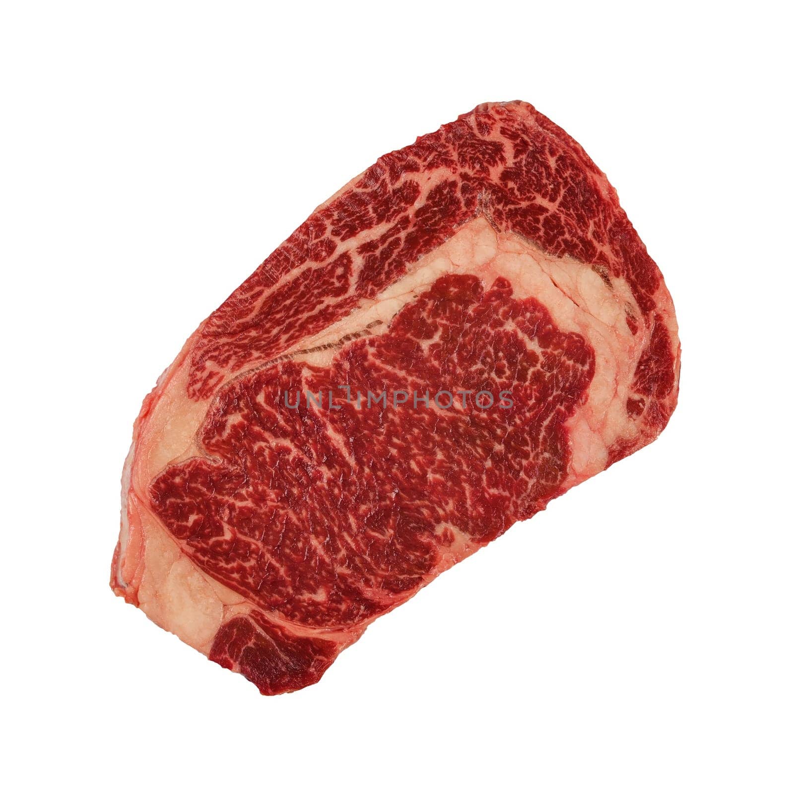 Close up one marbled raw ribeye beef steak isolated on white background, elevated top view, directly above
