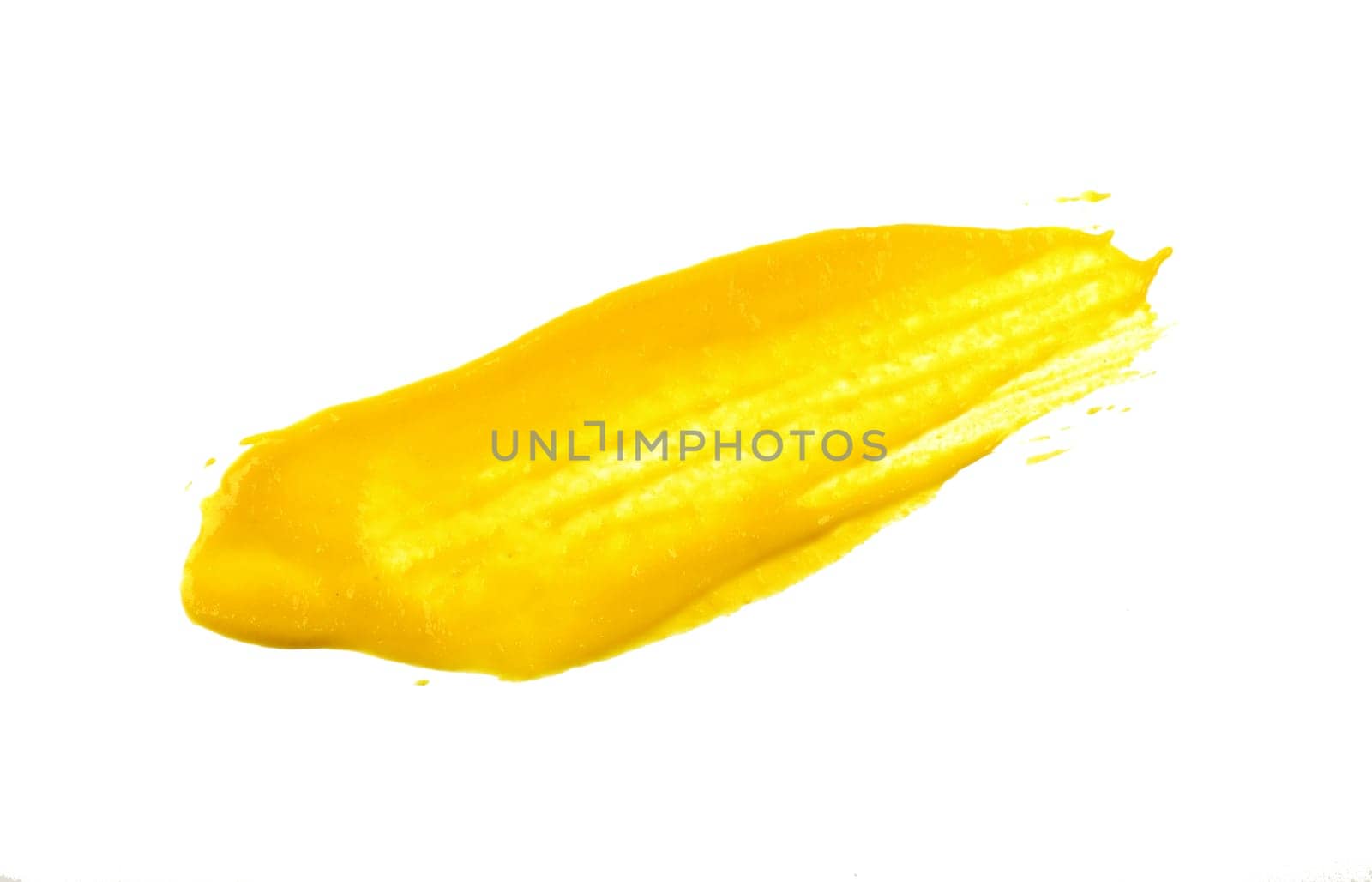 Close up stain of yellow American mustard isolated on white background, top view, directly above
