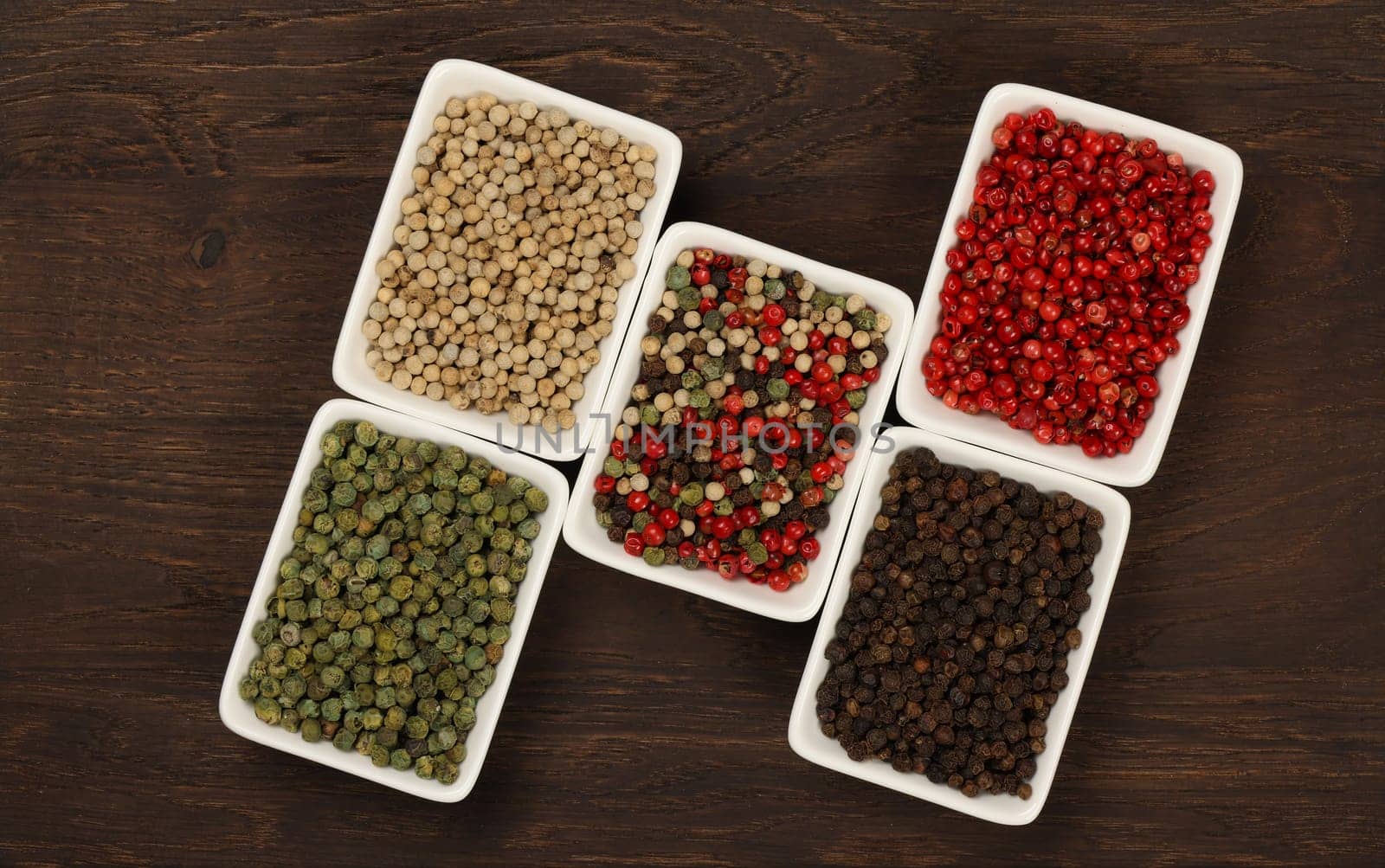 Bowls of assorted peppercorns by BreakingTheWalls