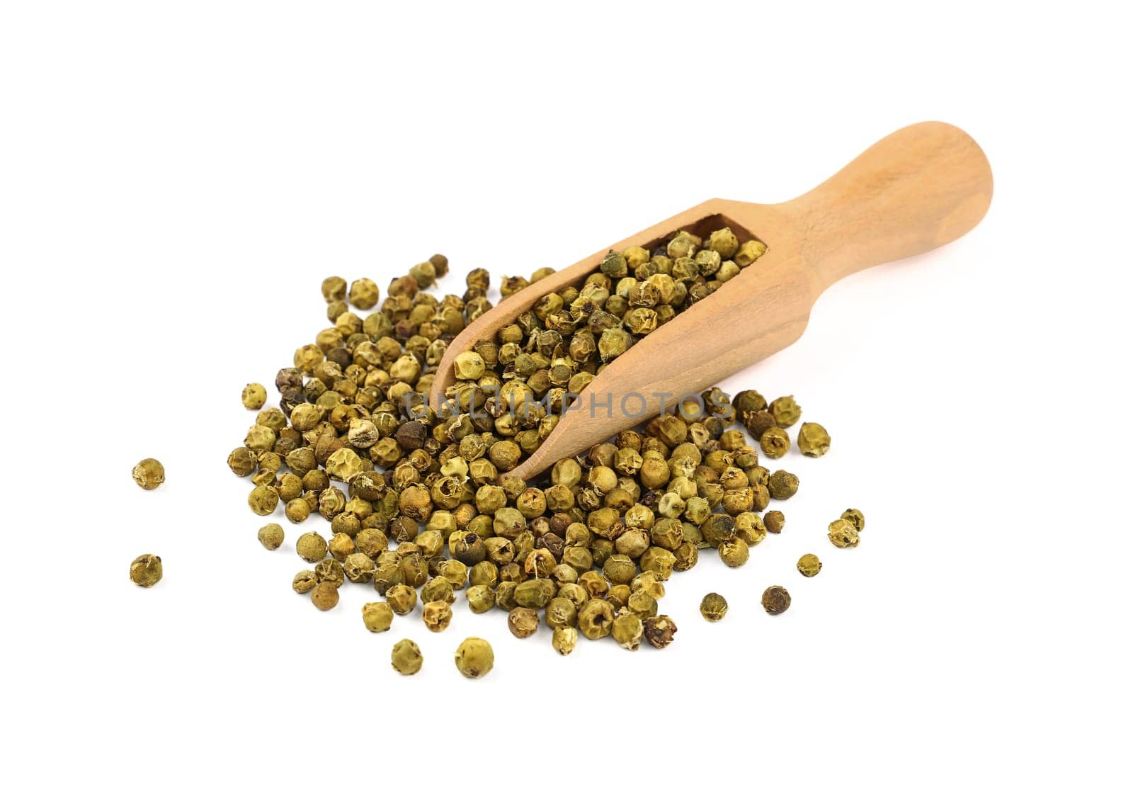 Close up one wooden scoop full of green pepper peppercorns and heap of peppercorns spilled and spread around isolated on white background, high angle view