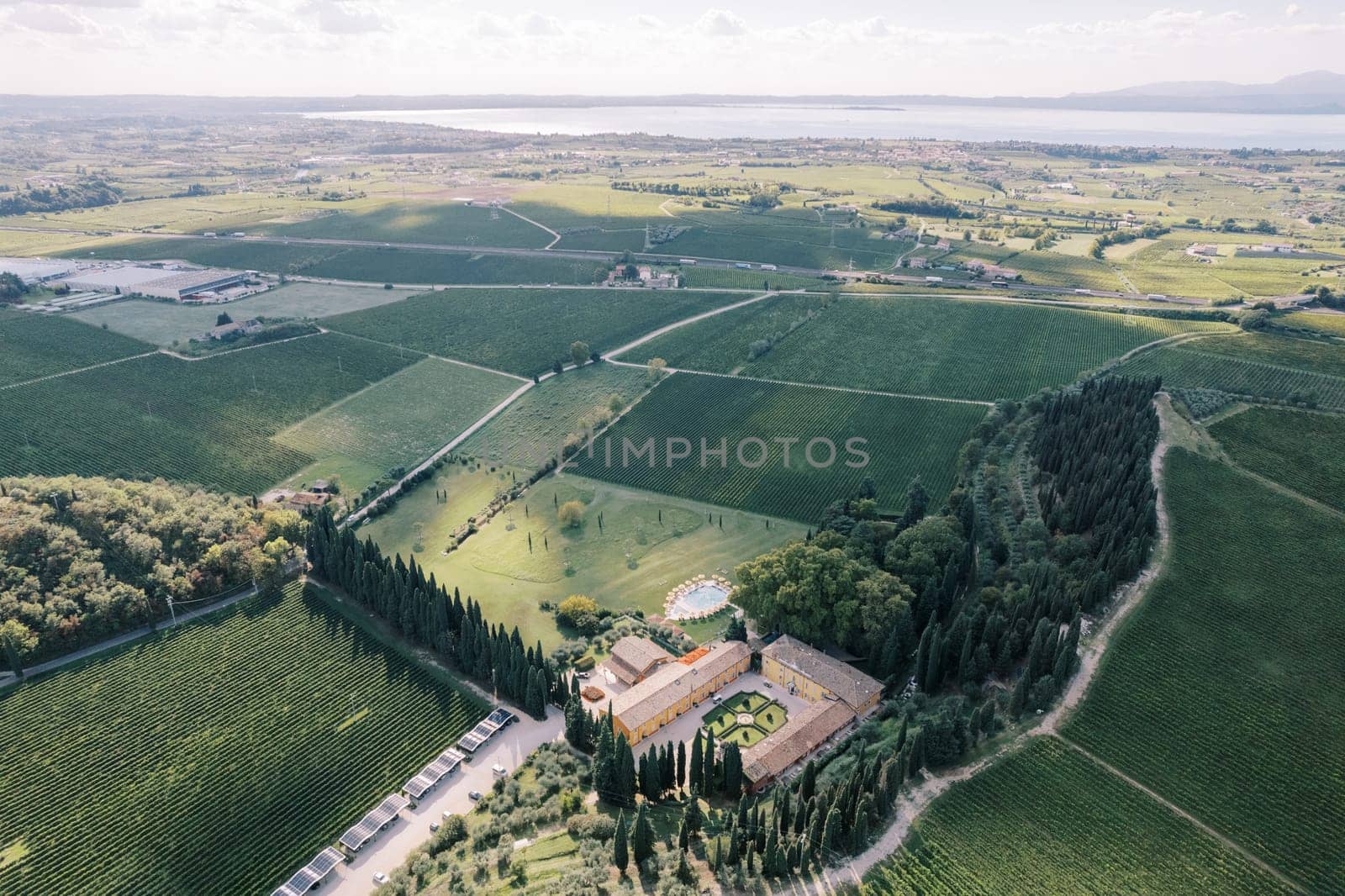 Drone view of Villa Cordevigo in a green garden surrounded by fields. Verona, Italy. High quality photo