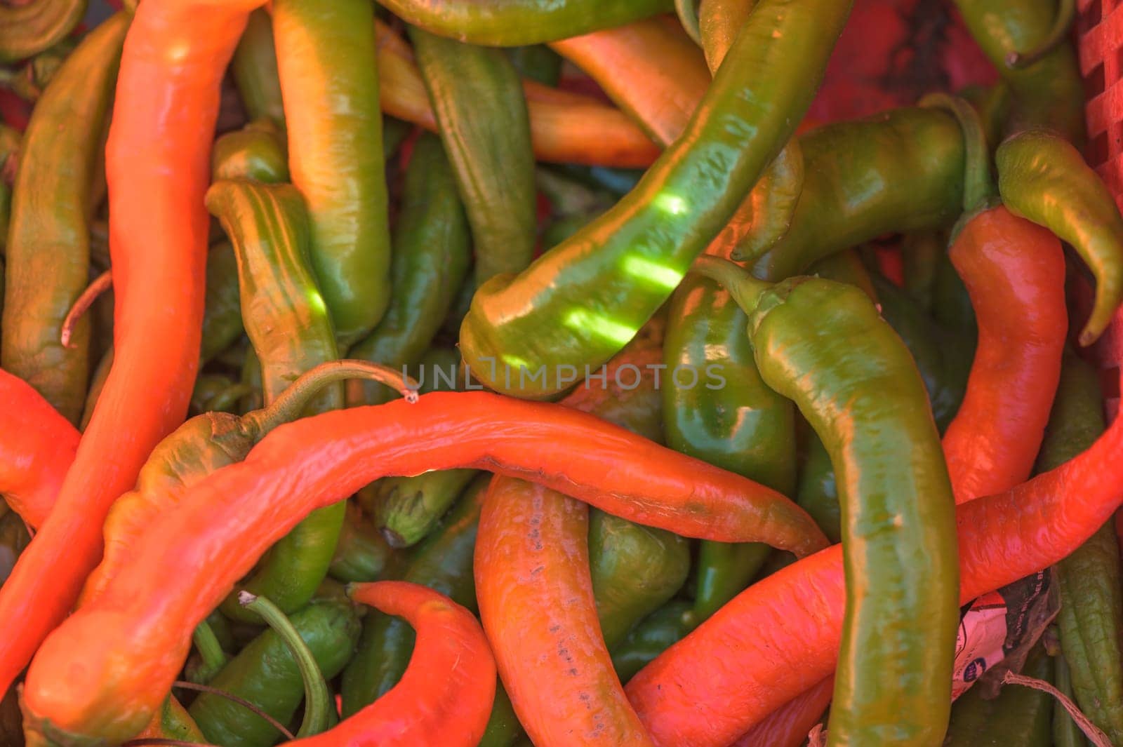red and green peppers in a box near the store